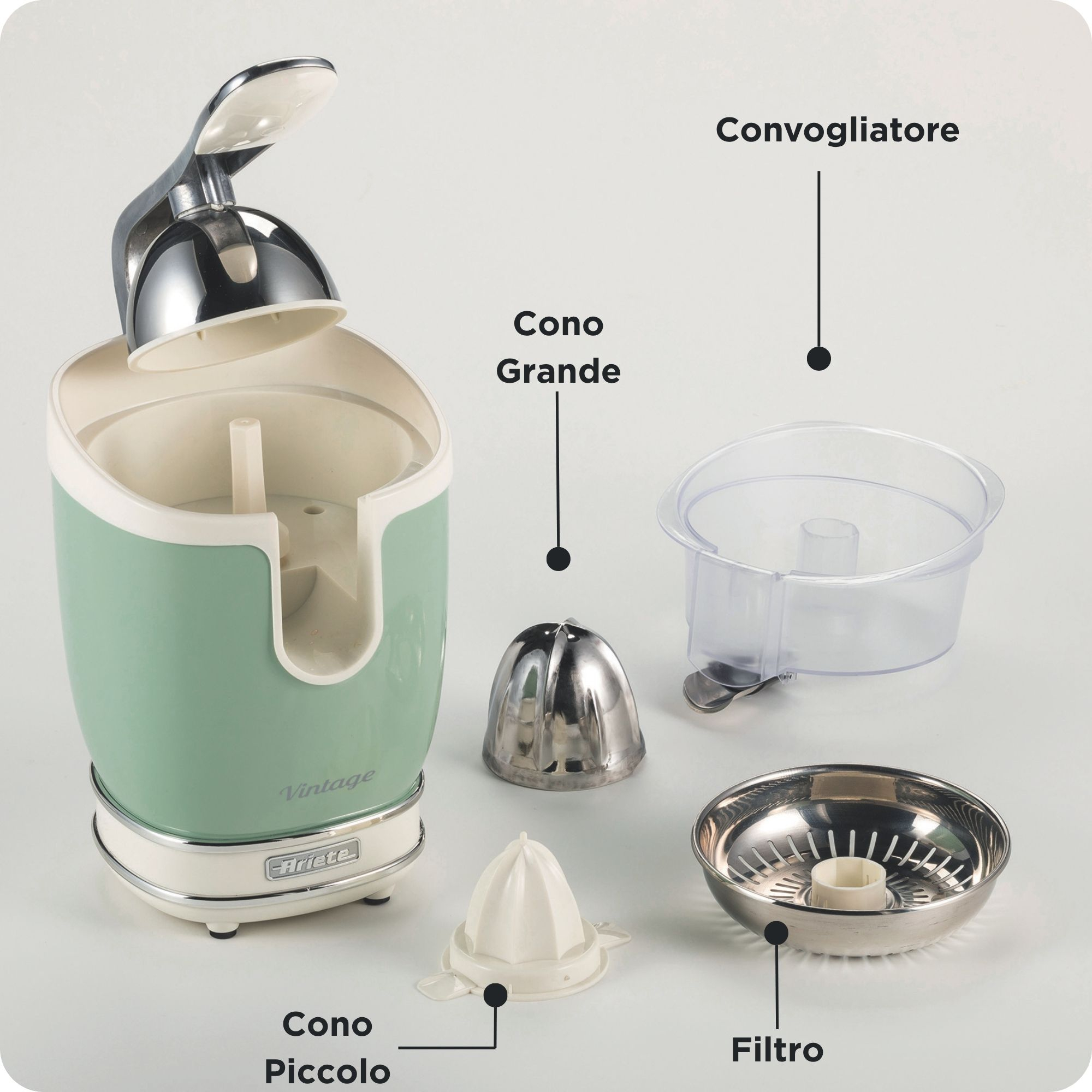 Un extracteur de jus vert menthe avec accessoires : cône grand et petit, filtre, récipient.
