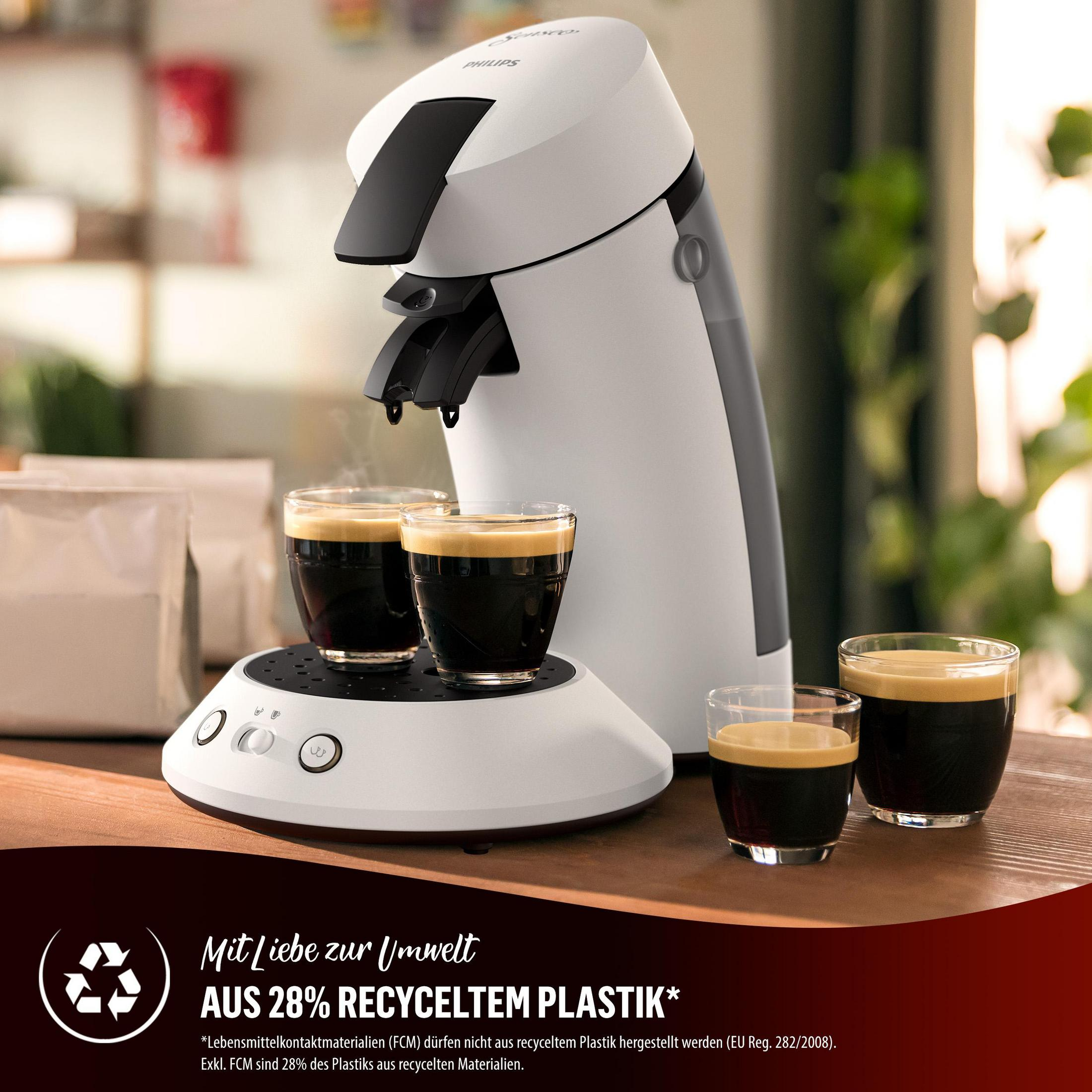 Eine weiße Philips Senseo-Kaffeemaschine brüht Kaffee in Gläser.