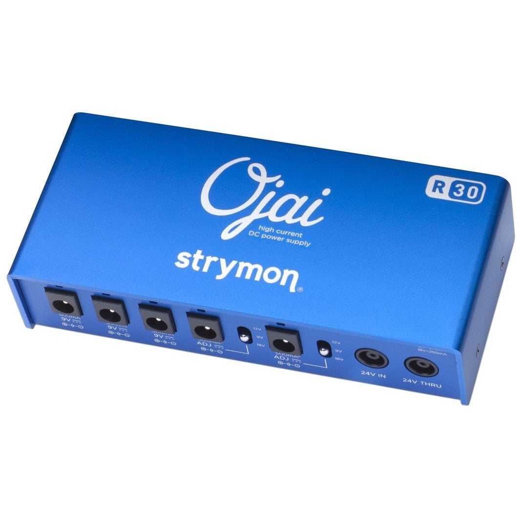 A blue Strymon Ojai R30 DC power supply with multiple outputs on the front.