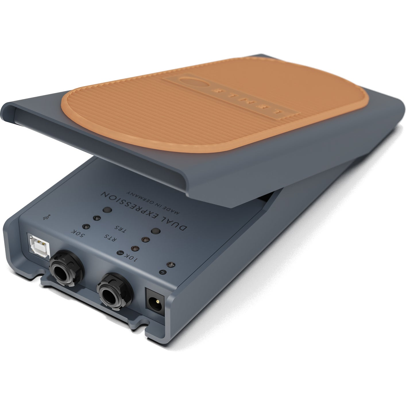 A gray expression pedal with a tan top and ports.