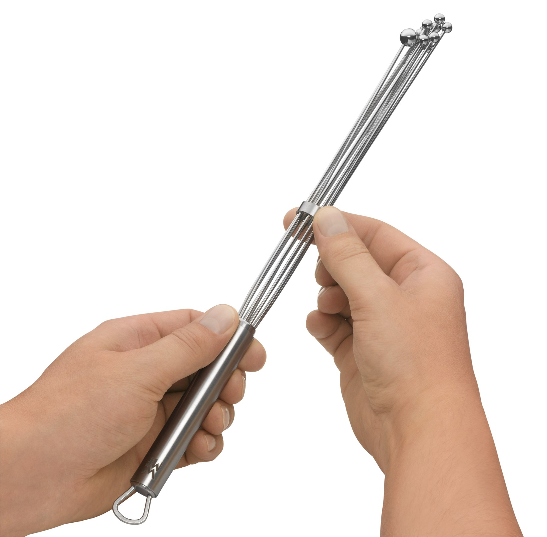 Dwie ręce trzymają metalową trzepaczkę z kulkami na końcach.