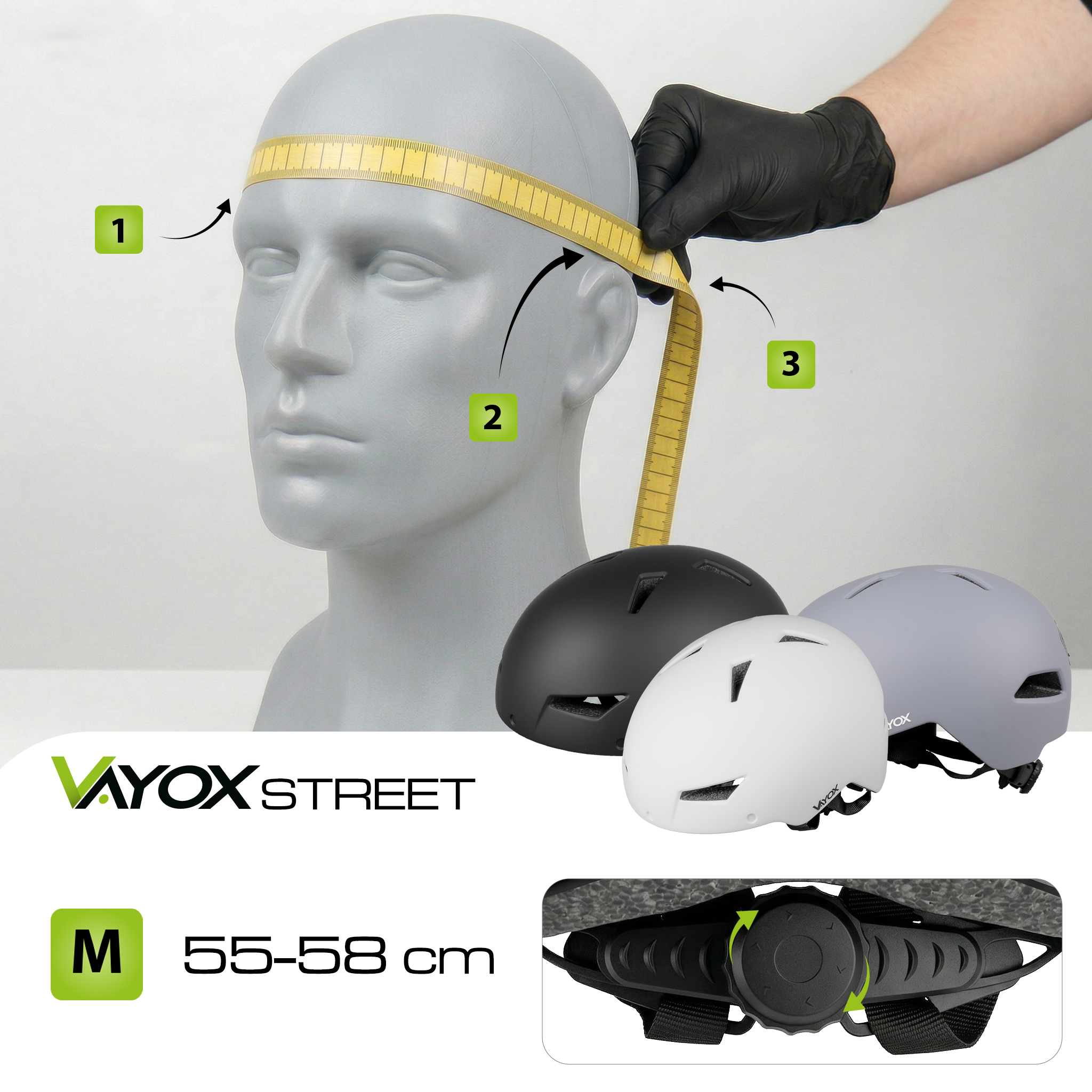 Głowa manekina mierzona taśmą. Poniżej kaski.