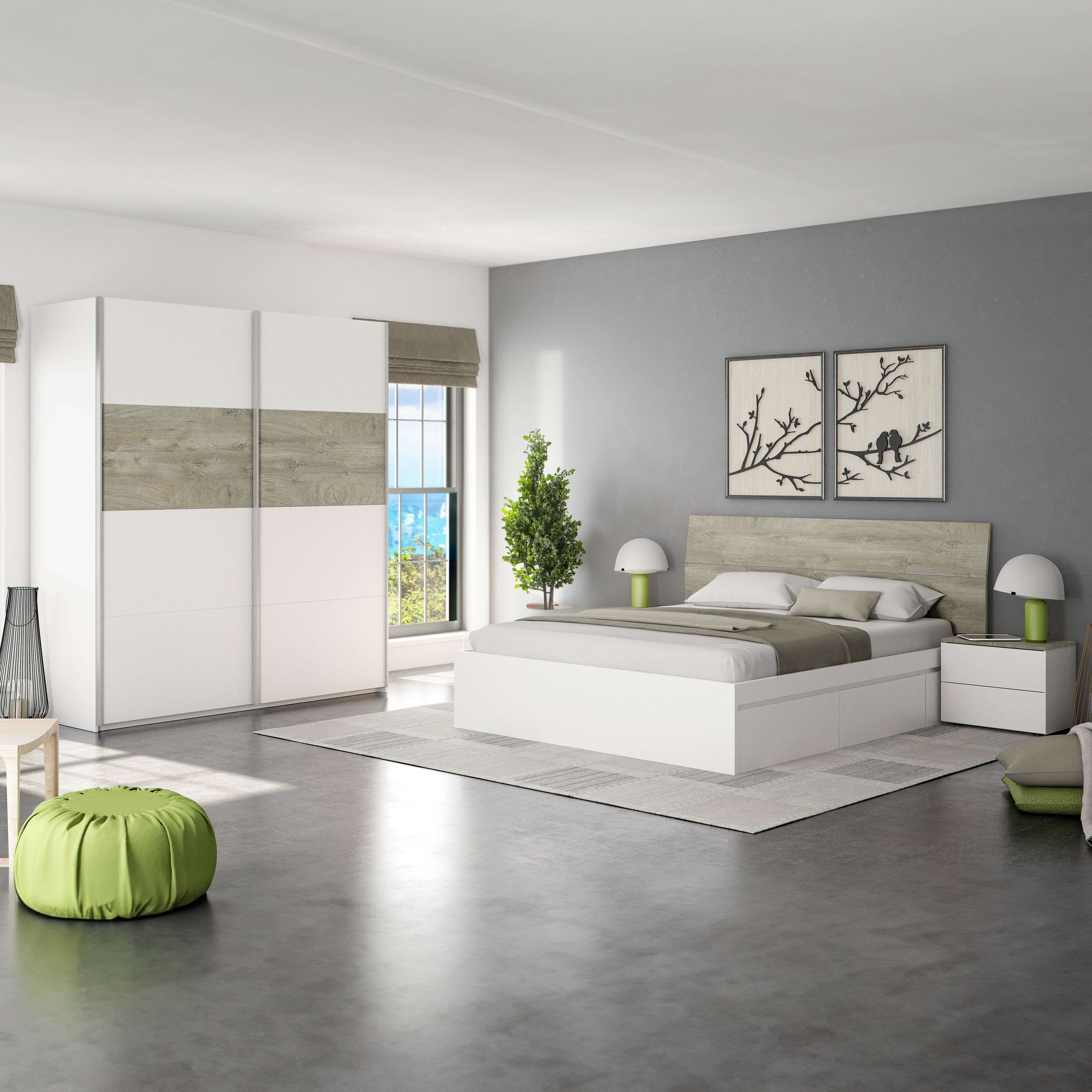 Dormitorio moderno con cama blanca, armario y puf verde.