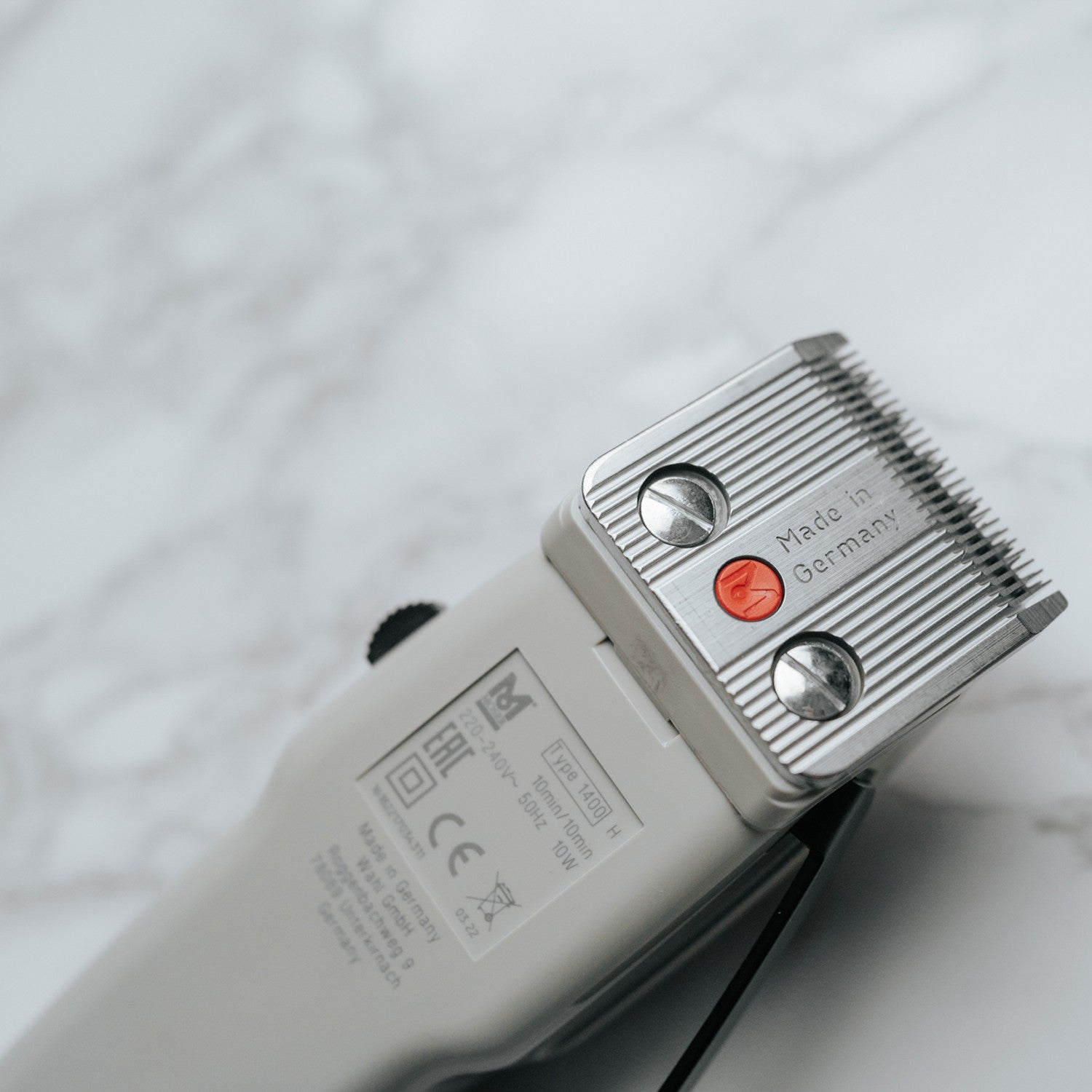 Gray hair clipper with metal blade, Made in Germany.