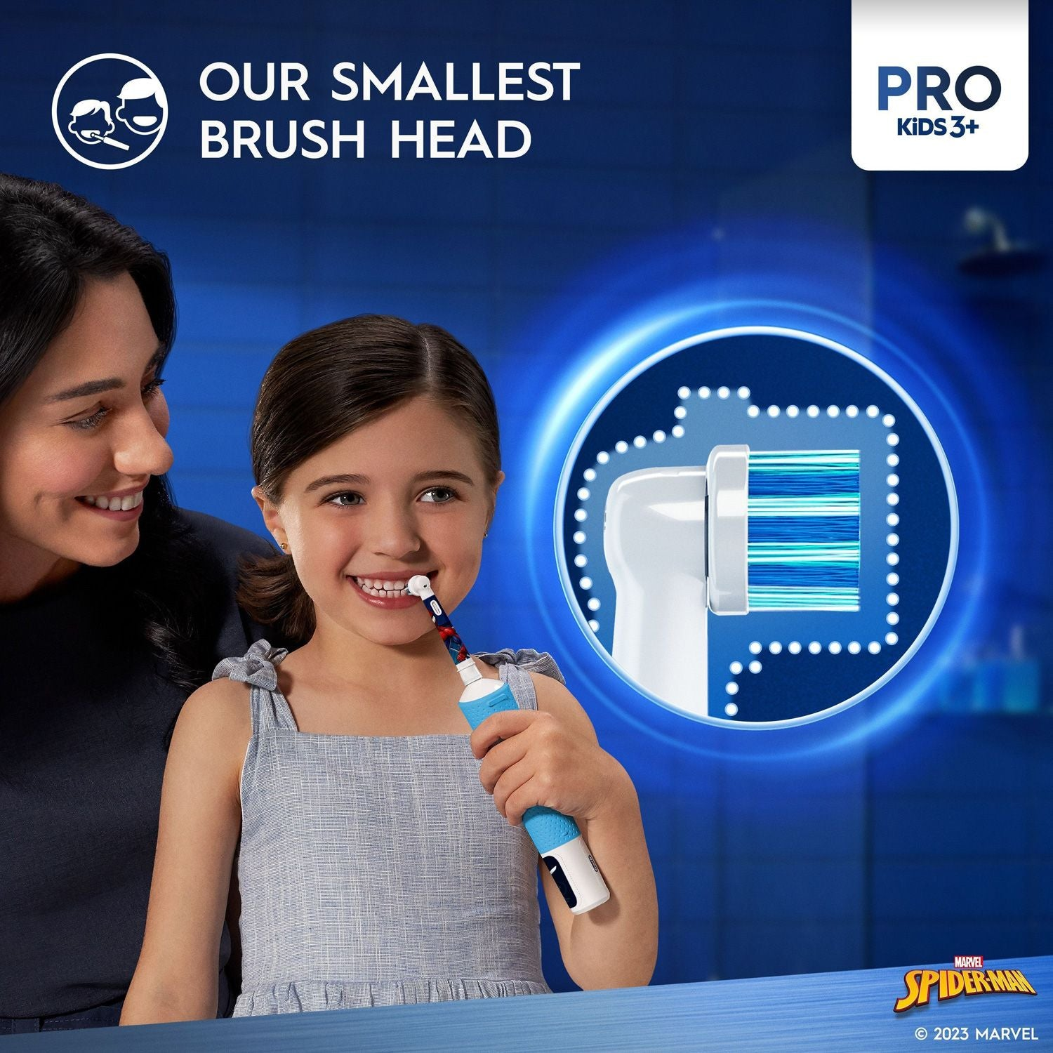 A girl brushes her teeth with an electric toothbrush, mother helps.