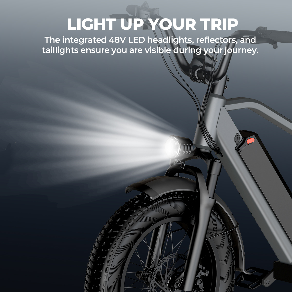 Szary rower elektryczny z włączonym światłem przednim LED, świecącym do przodu.