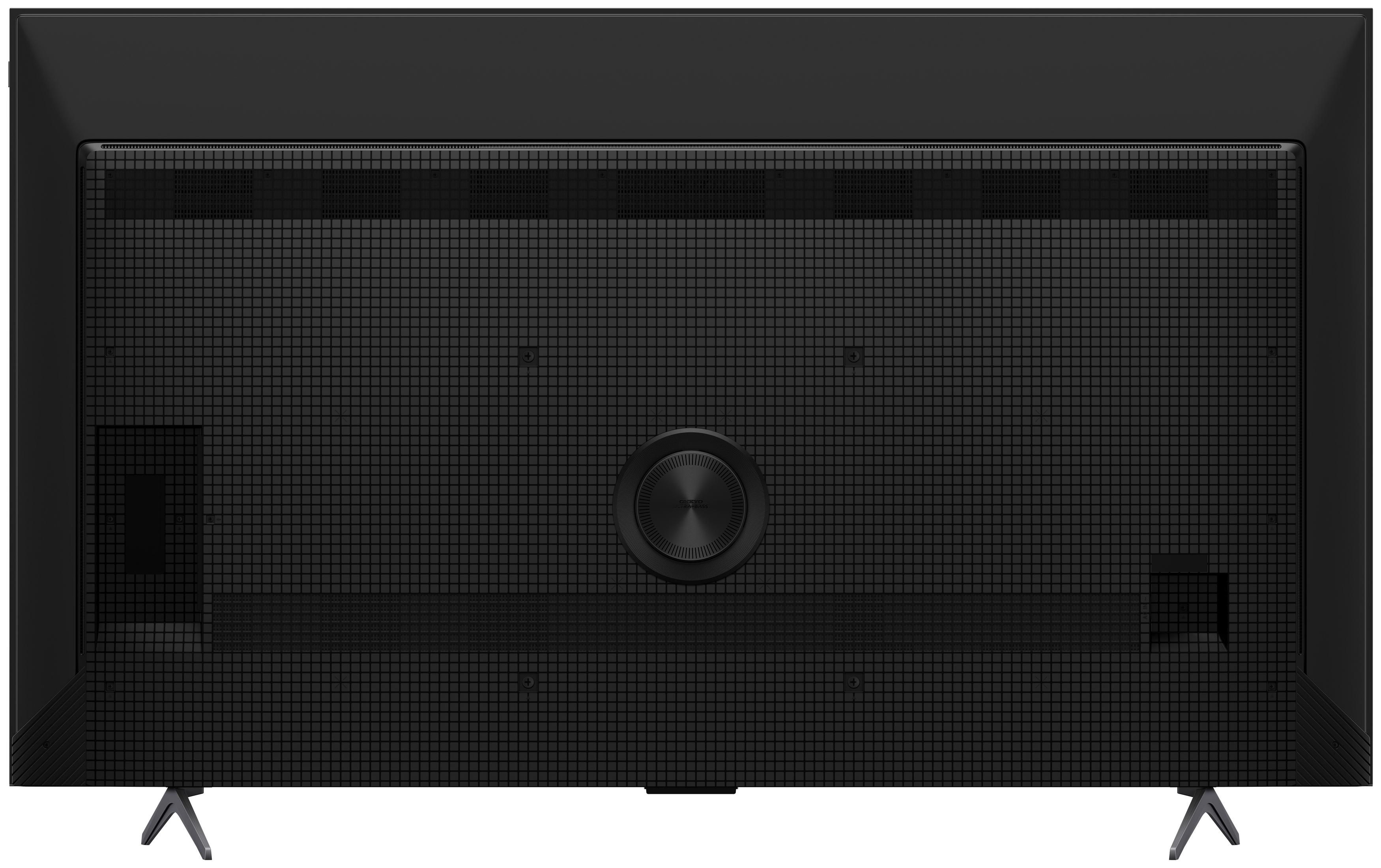 Tył czarnego telewizora z wzorem kratki i okrągłymi głośnikami.