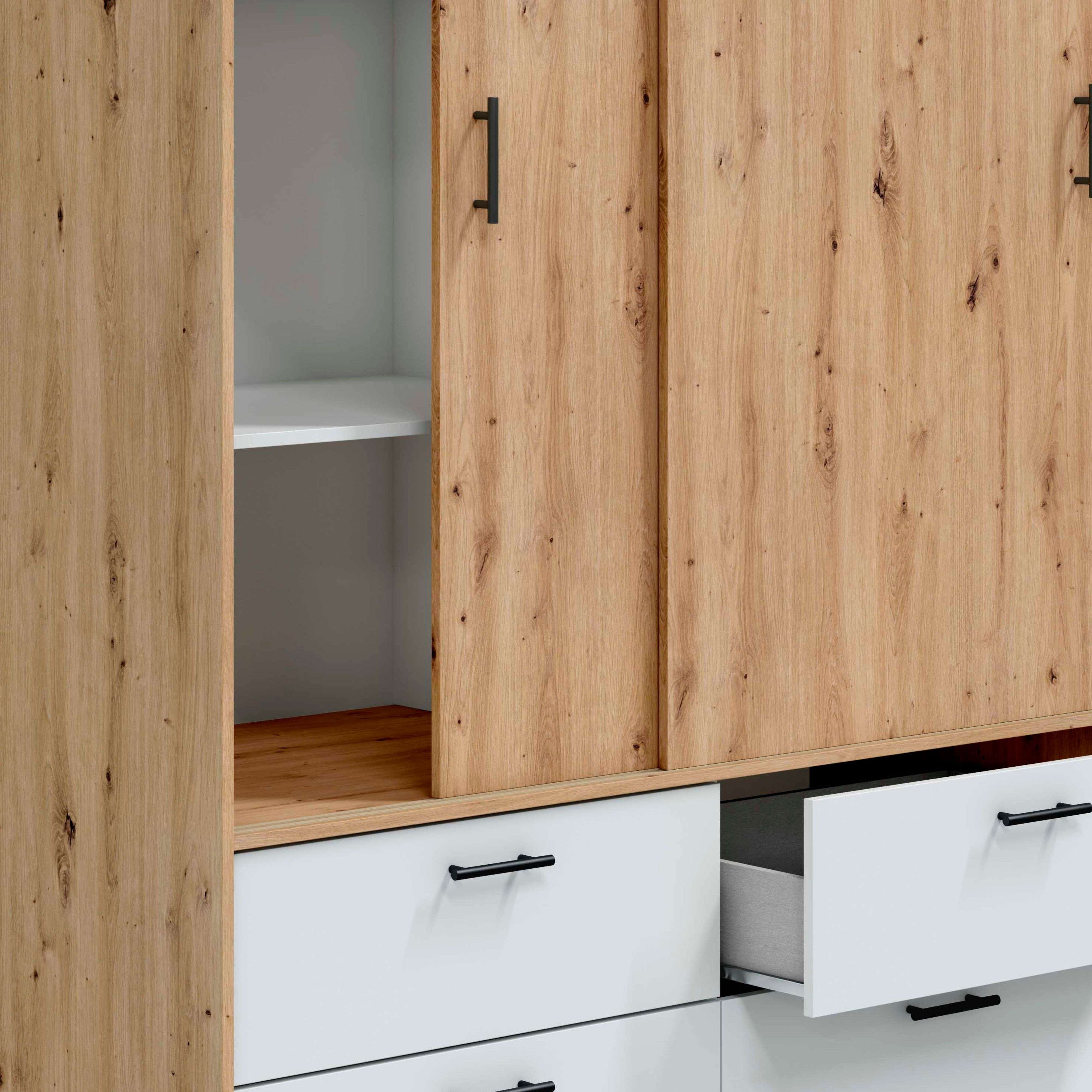 Armario de madera con cajones blancos y tiradores negros. Una puerta está abierta.