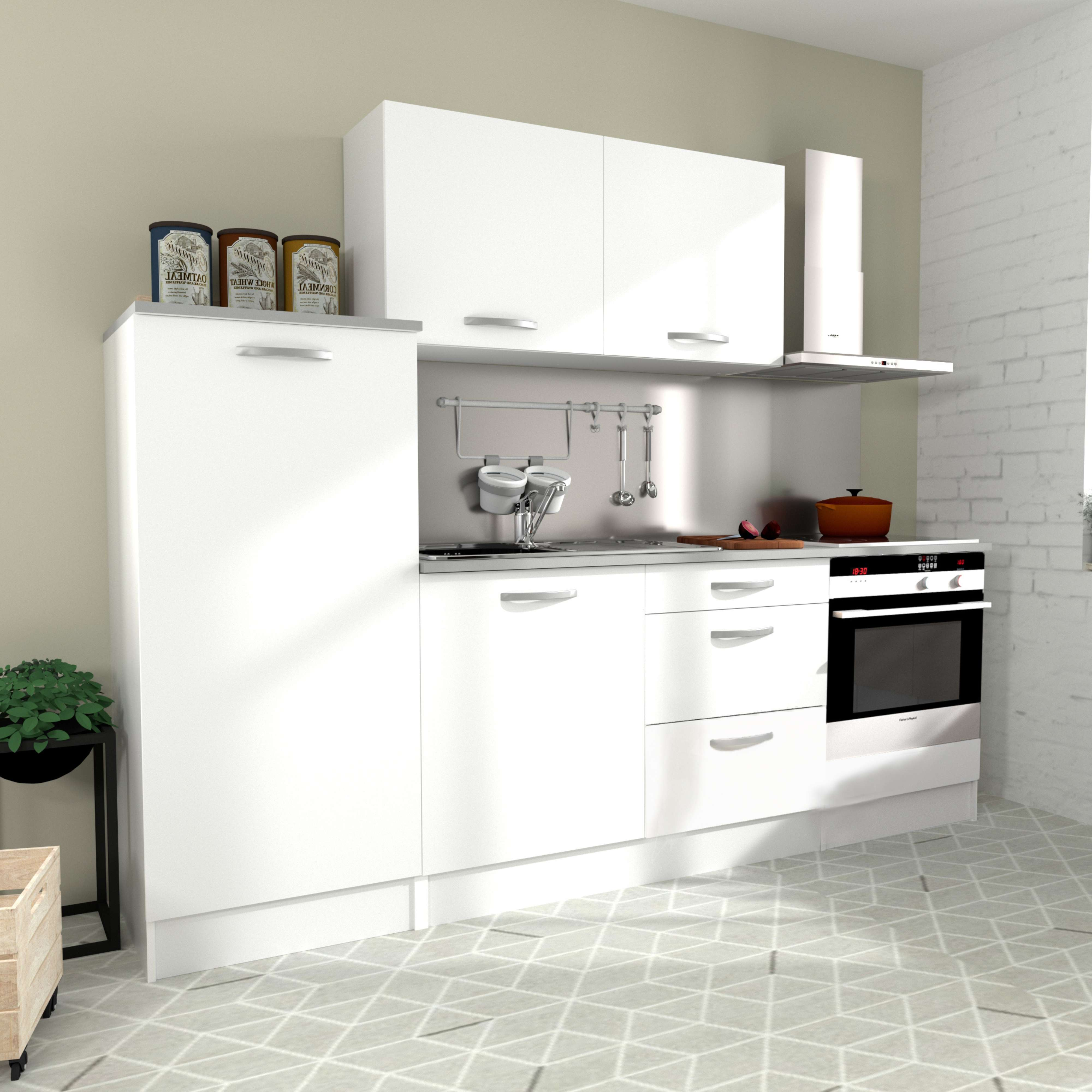 Una cocina blanca con electrodomésticos, utensilios y frascos.