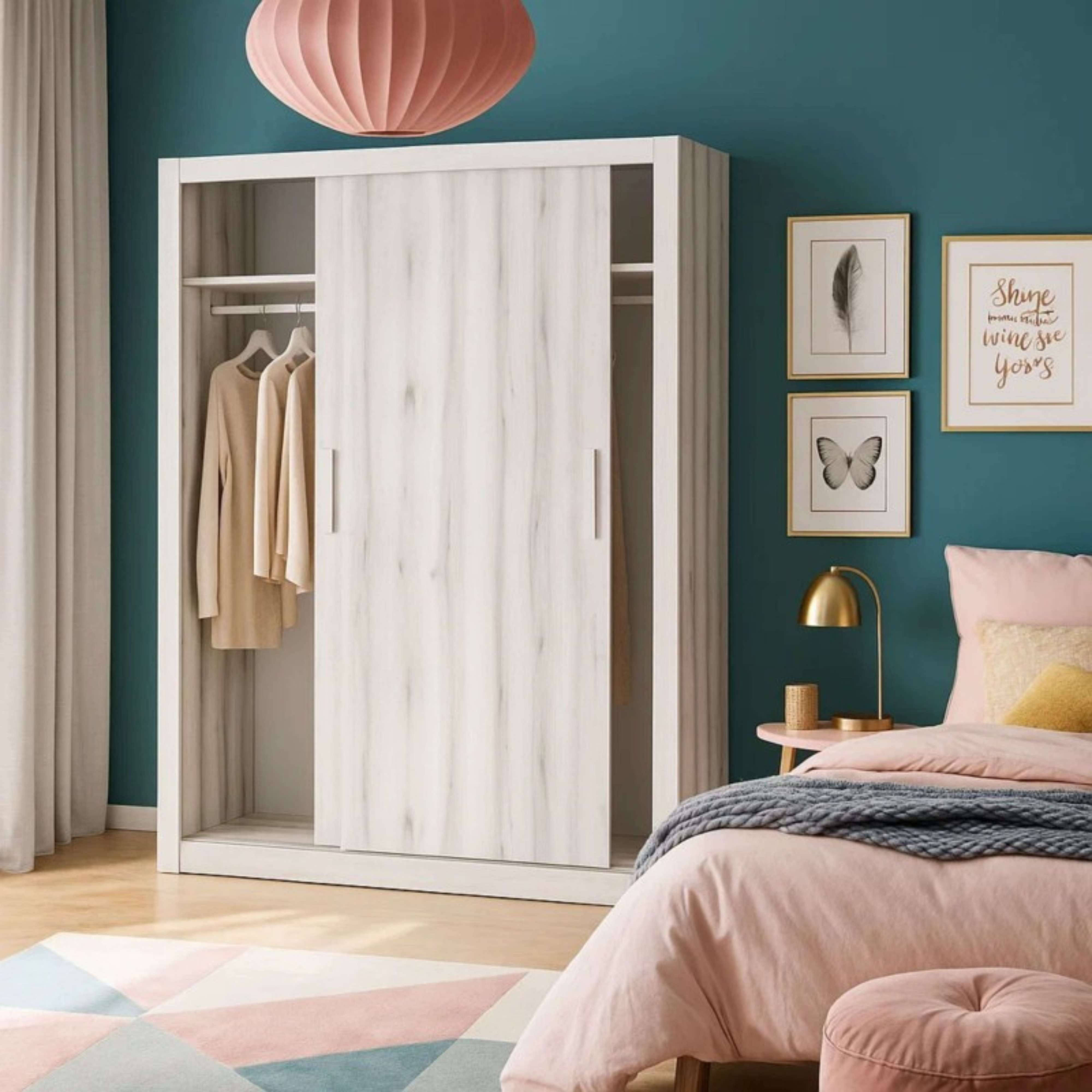 Un dormitorio con armario blanco, ropa, cama y arte de pared.