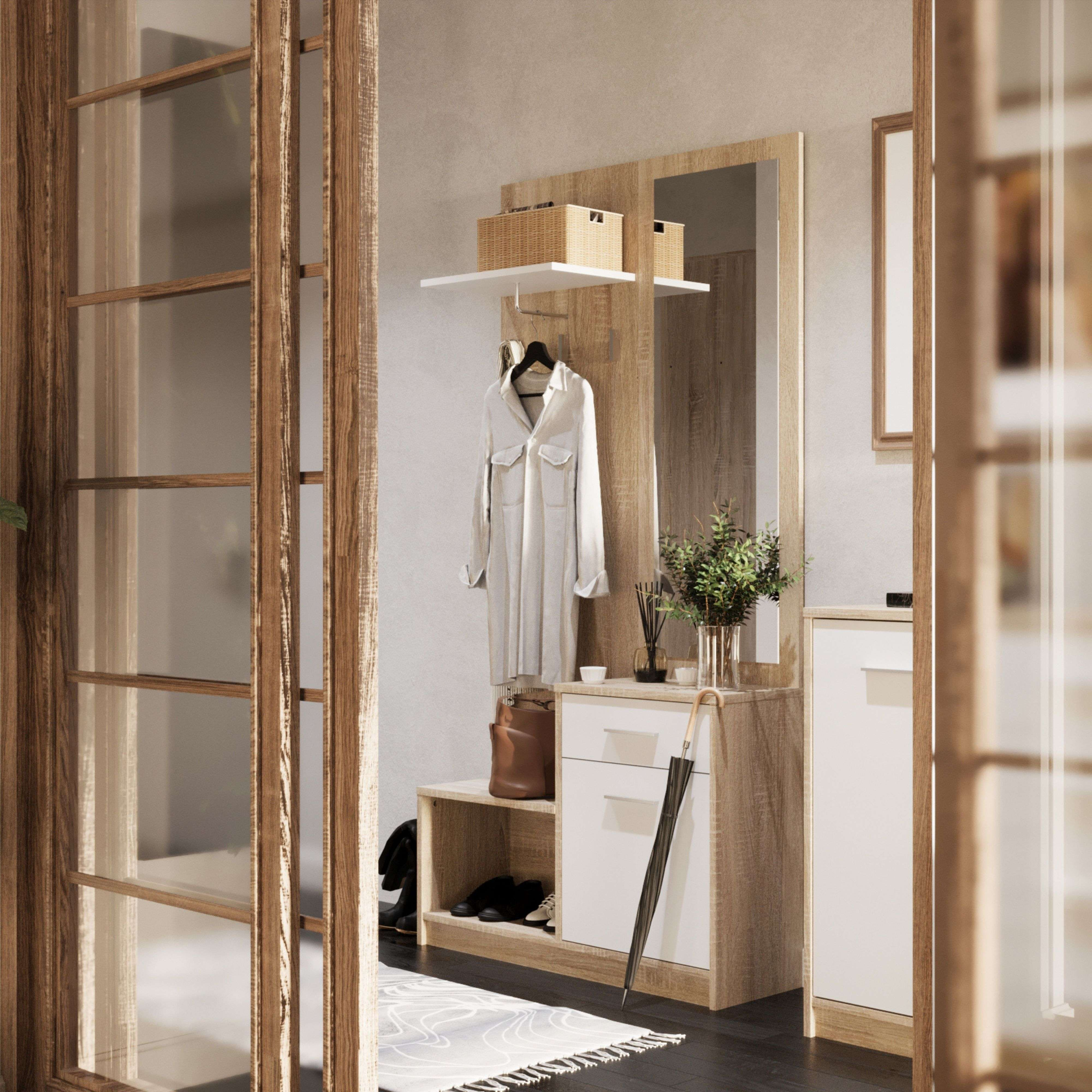 Un mueble de recibidor con ropa, bolso, zapatero y espejo.