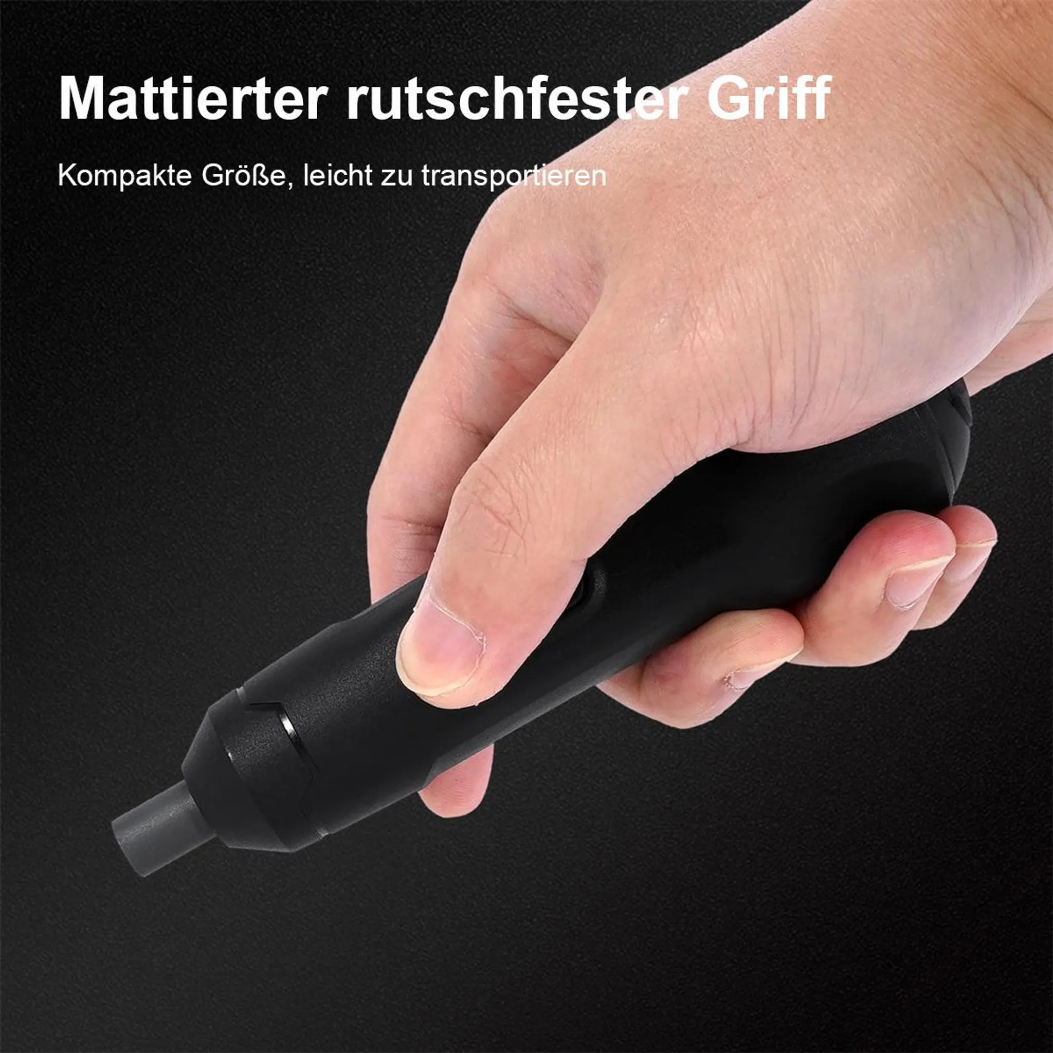 Eine Hand hält einen schwarzen, kompakten Schraubendreher mit mattem Griff.