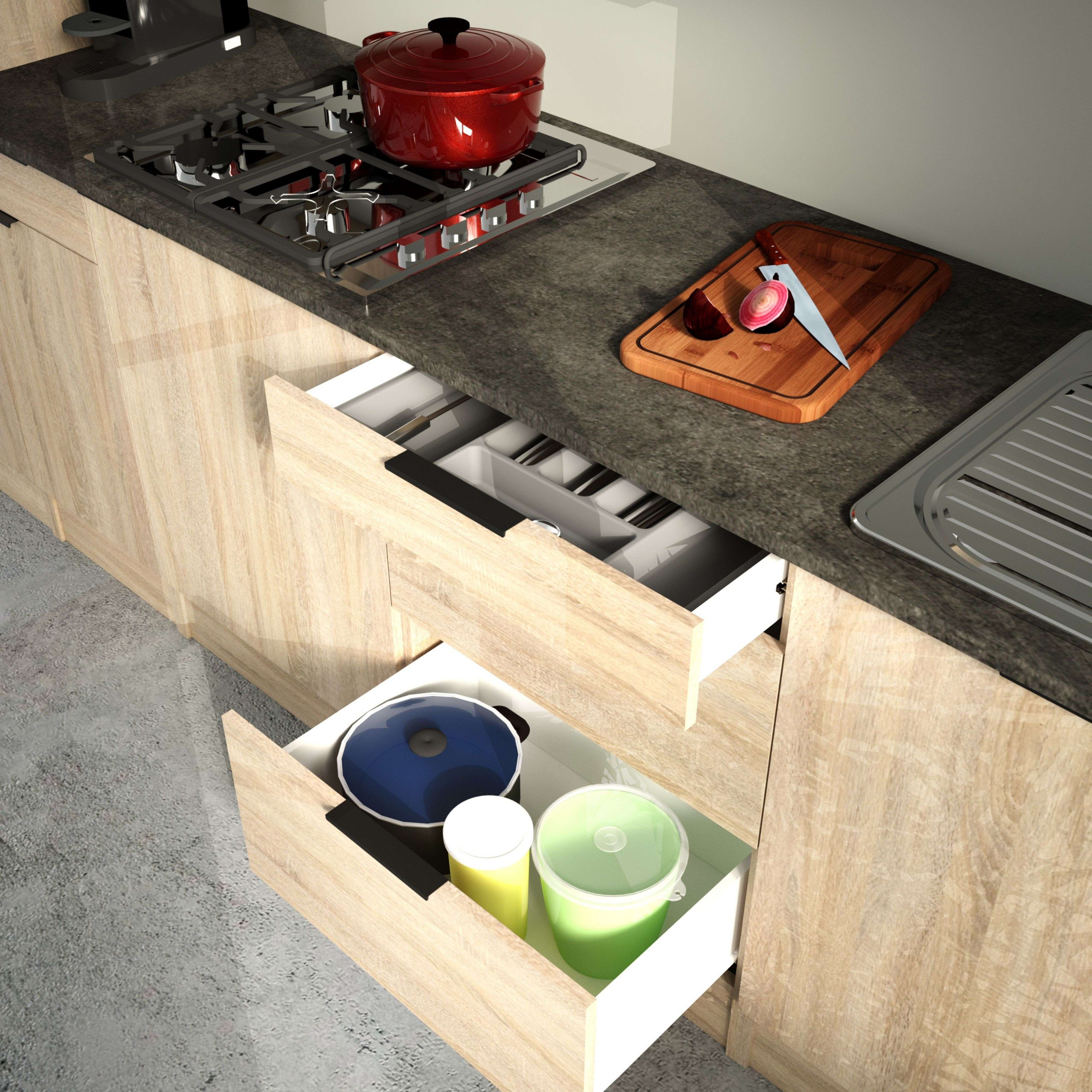 Una cocina con un cajón abierto, una olla roja en la estufa y una tabla de cortar.