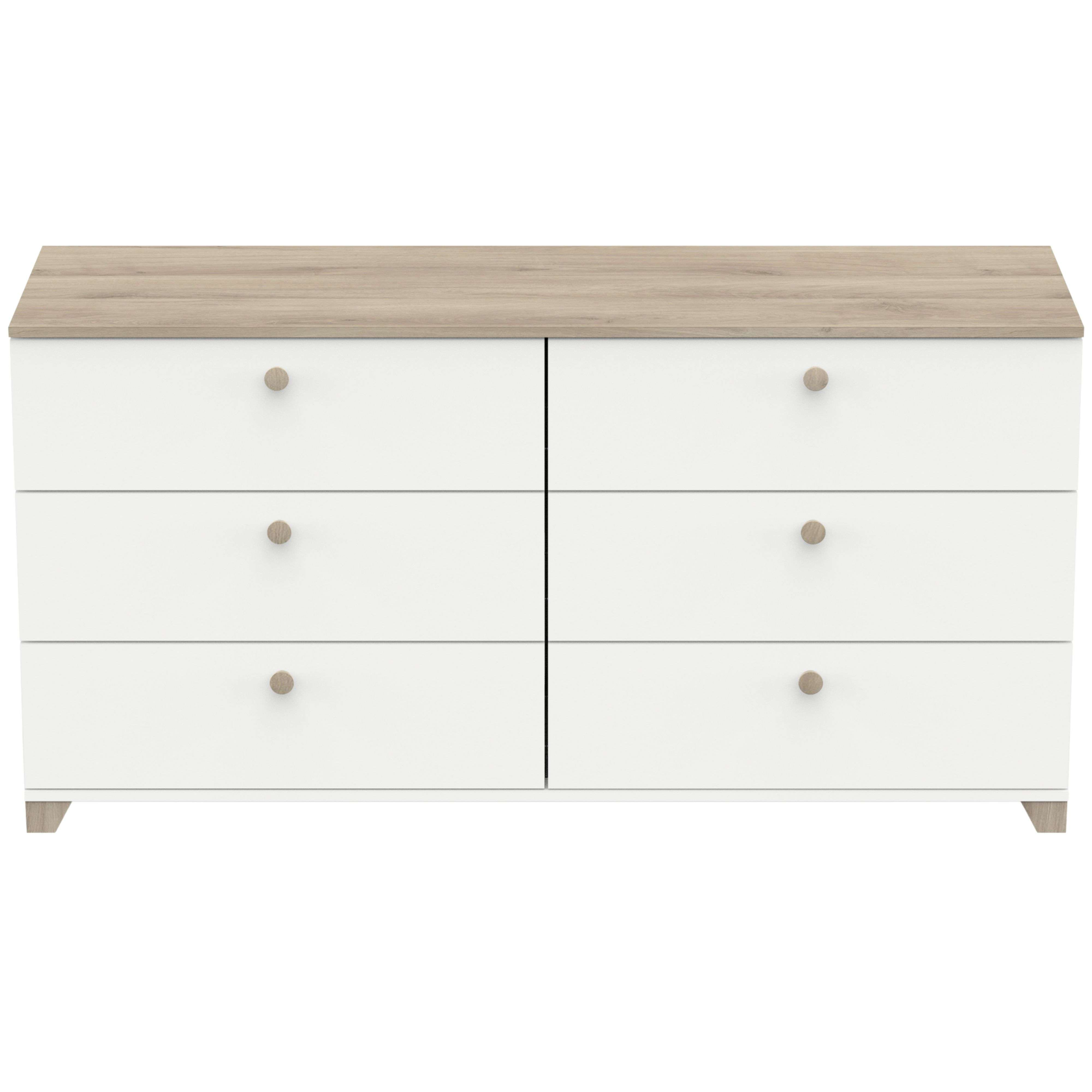 Una cómoda blanca con seis cajones y tapa de madera.
