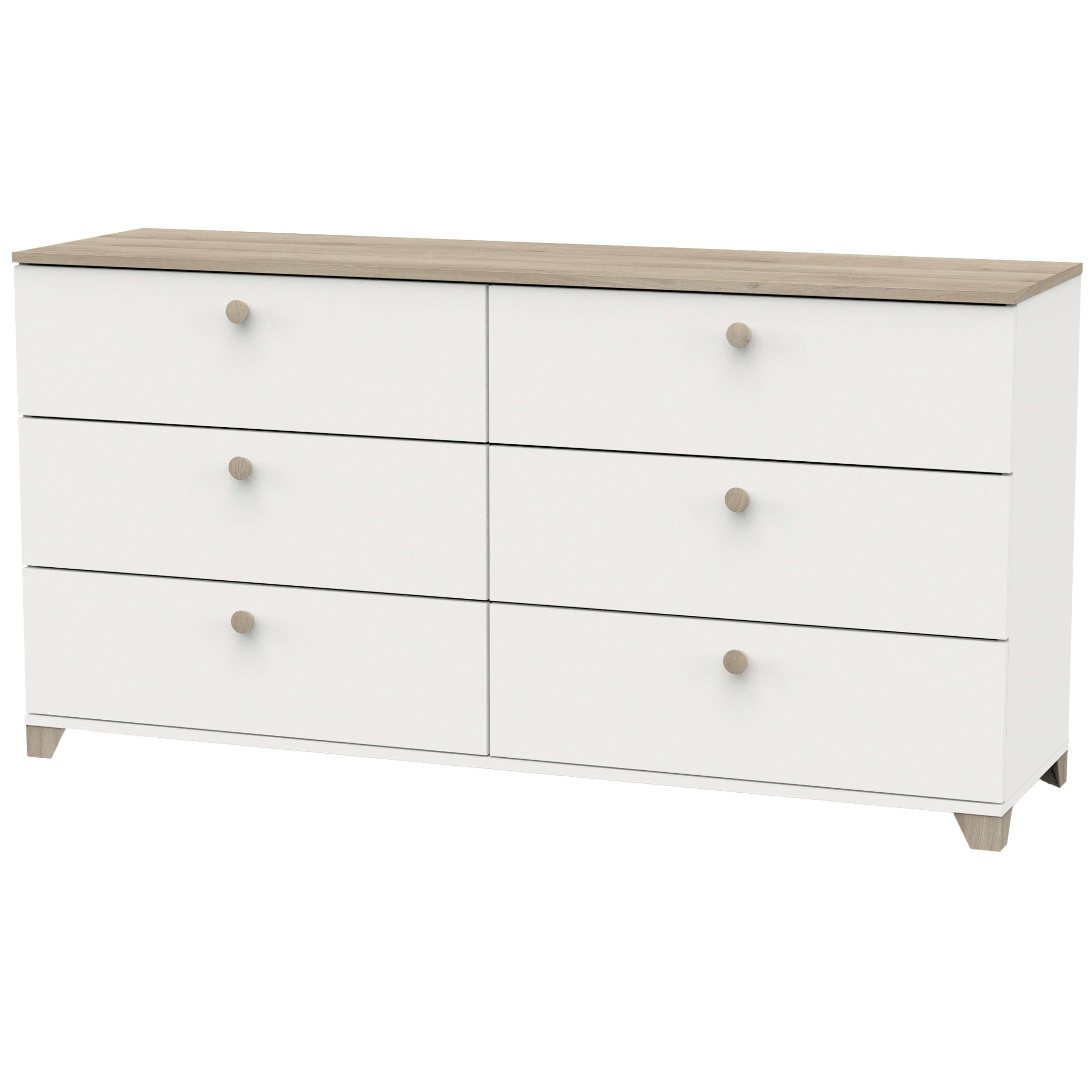Una cómoda blanca con seis cajones y detalles de pomo de madera.