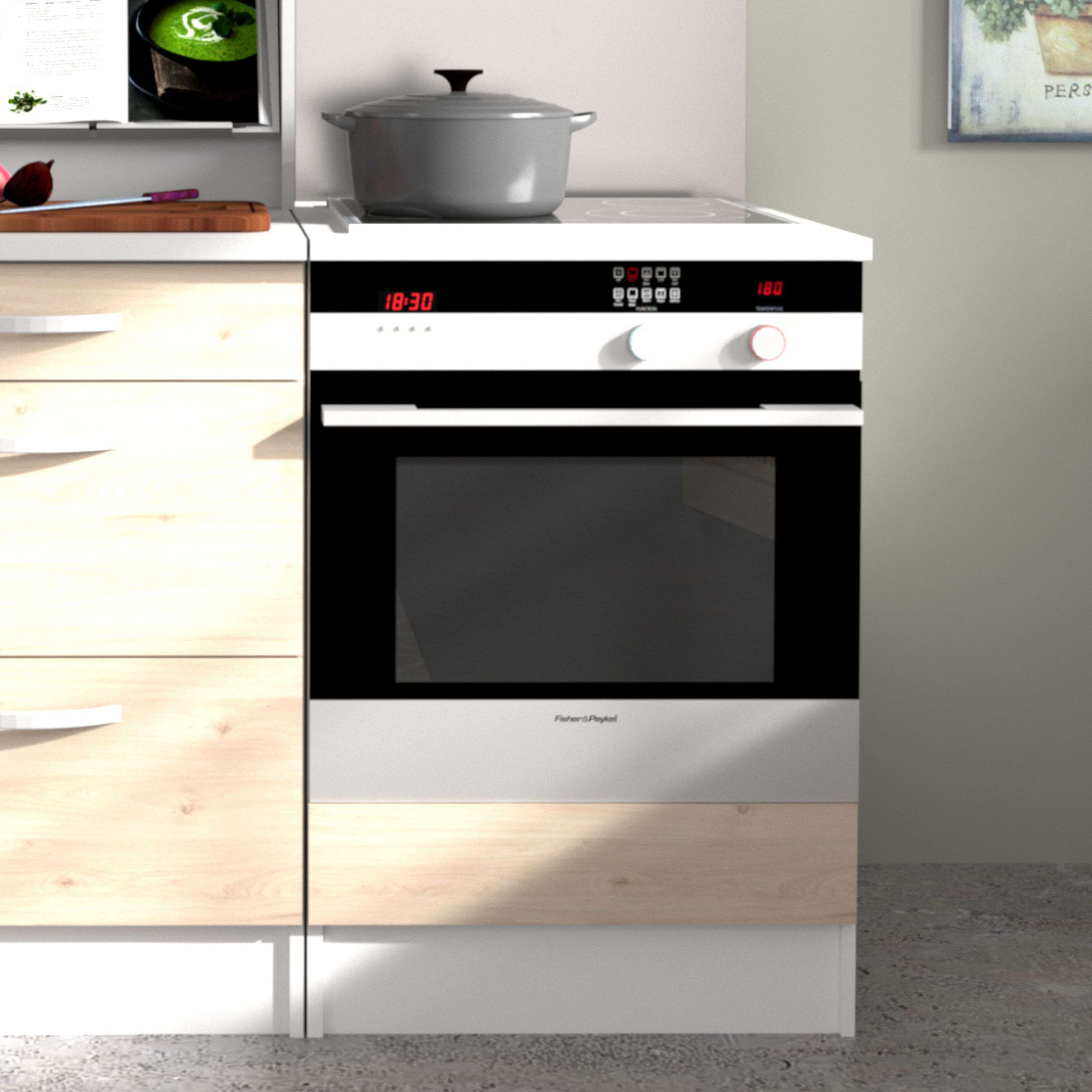 Un horno moderno con placa y cajones al lado.