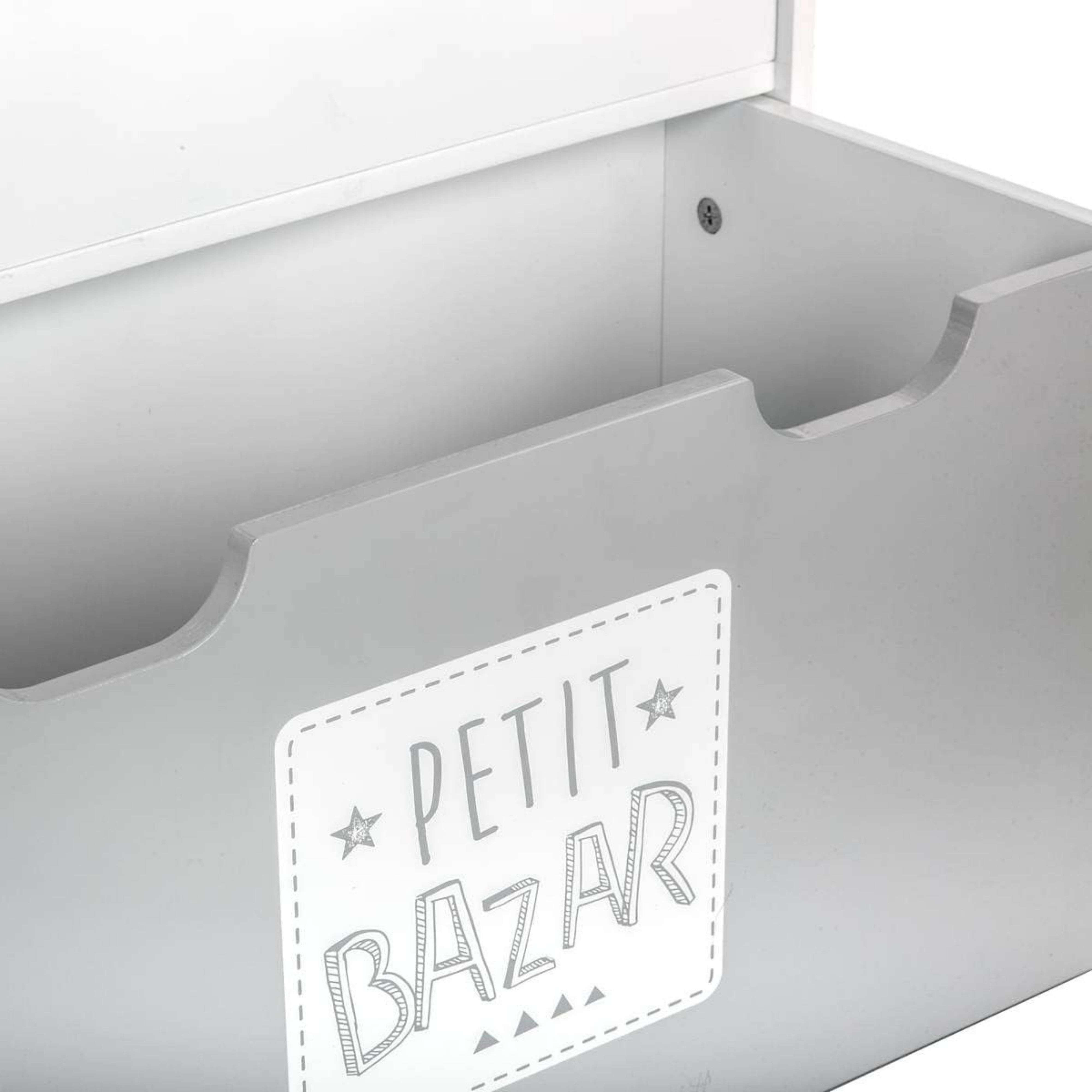 Caja gris con la inscripción "Petit Bazar" y estrellas.