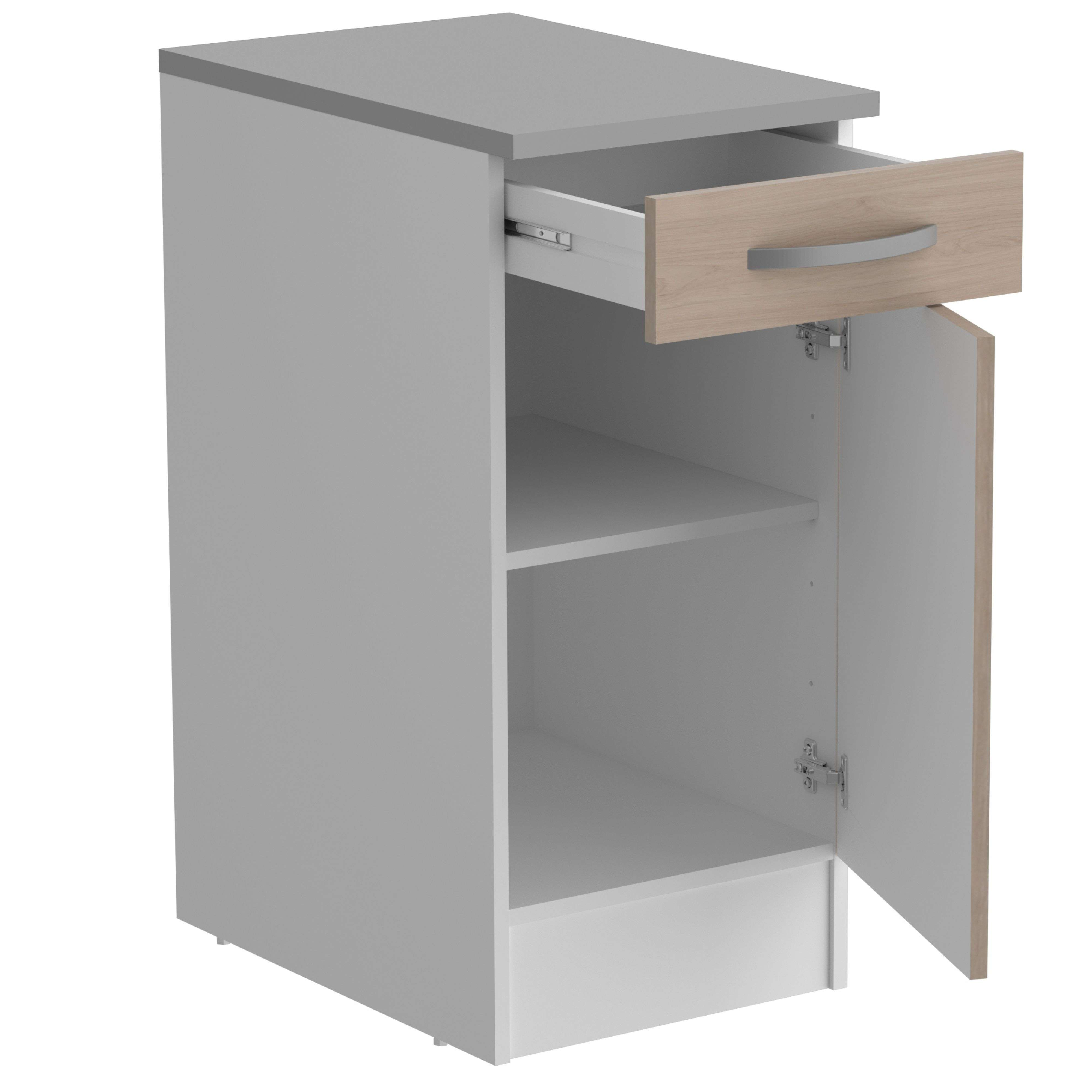 Un armario blanco con puerta y cajón de madera abiertos. Se ven estantes en el interior.