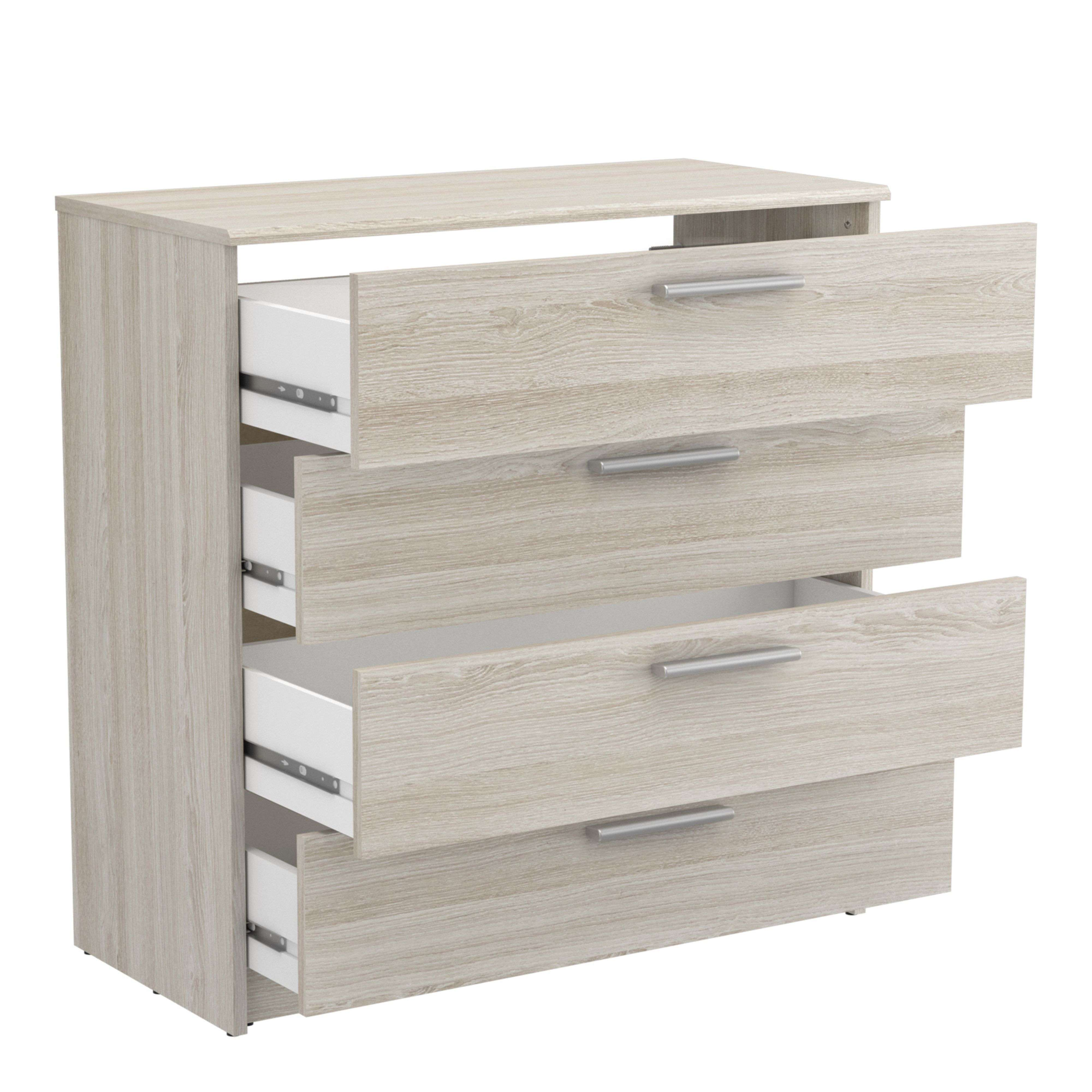 Cómoda de madera clara con cuatro cajones, algunos abiertos.