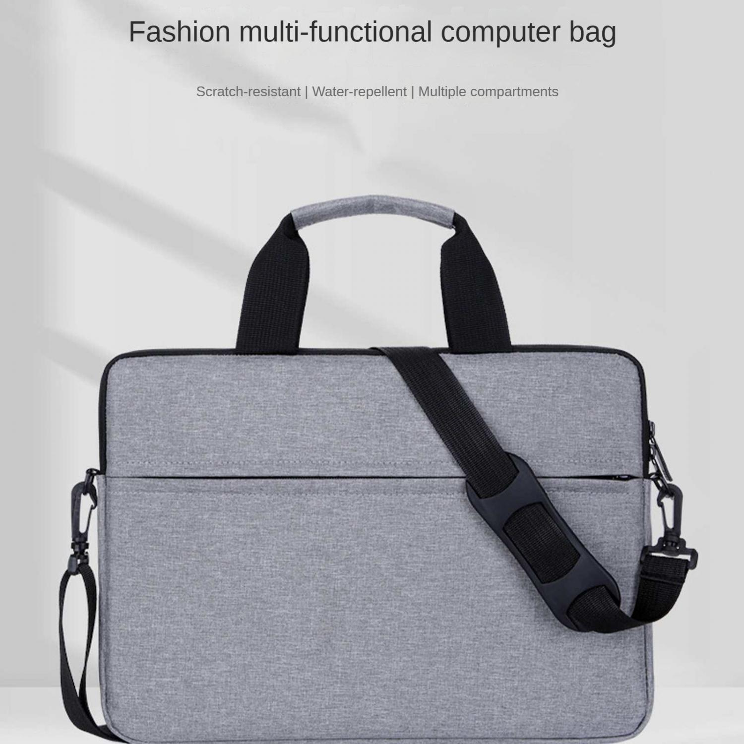 Graue Laptoptasche mit schwarzem Riemen und Henkeln. Mehrere Fächer sichtbar.