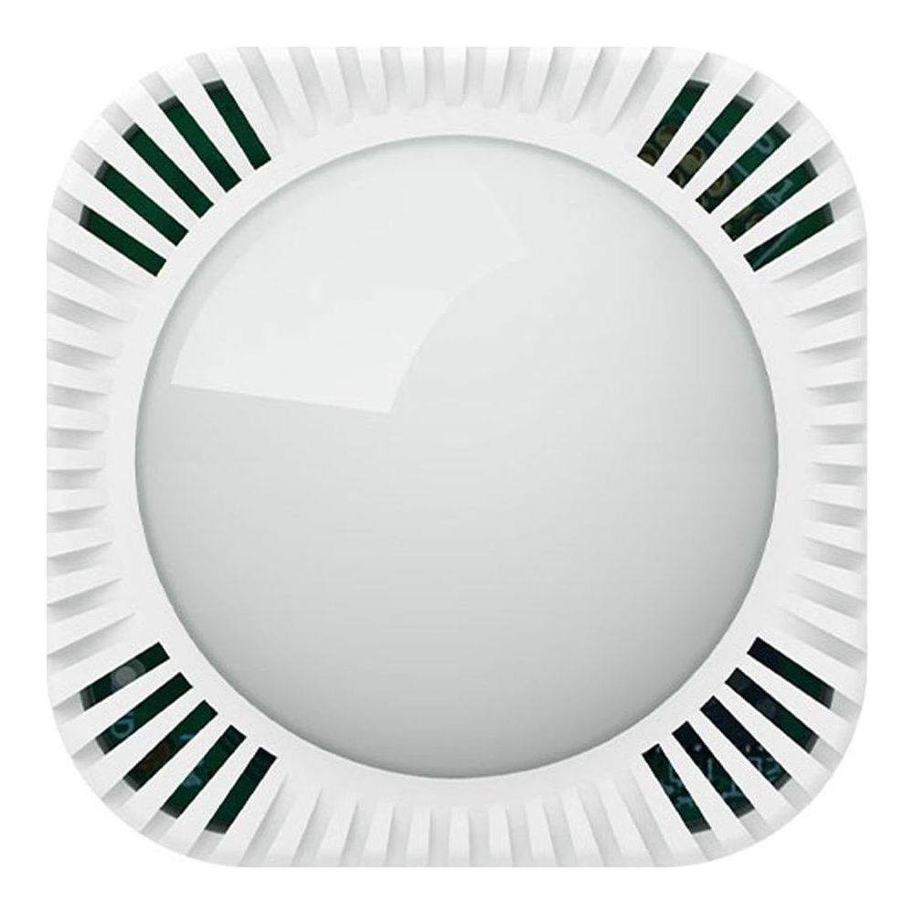 Un dispositivo rotondo bianco con fessure di ventilazione e un centro liscio a cupola.