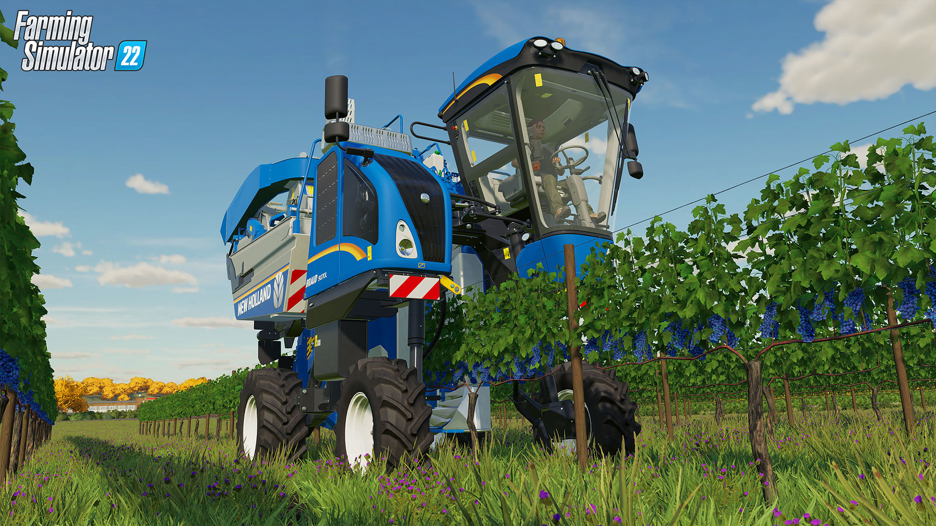 Un raccoglitore blu con accenti gialli attraversa un vigneto.