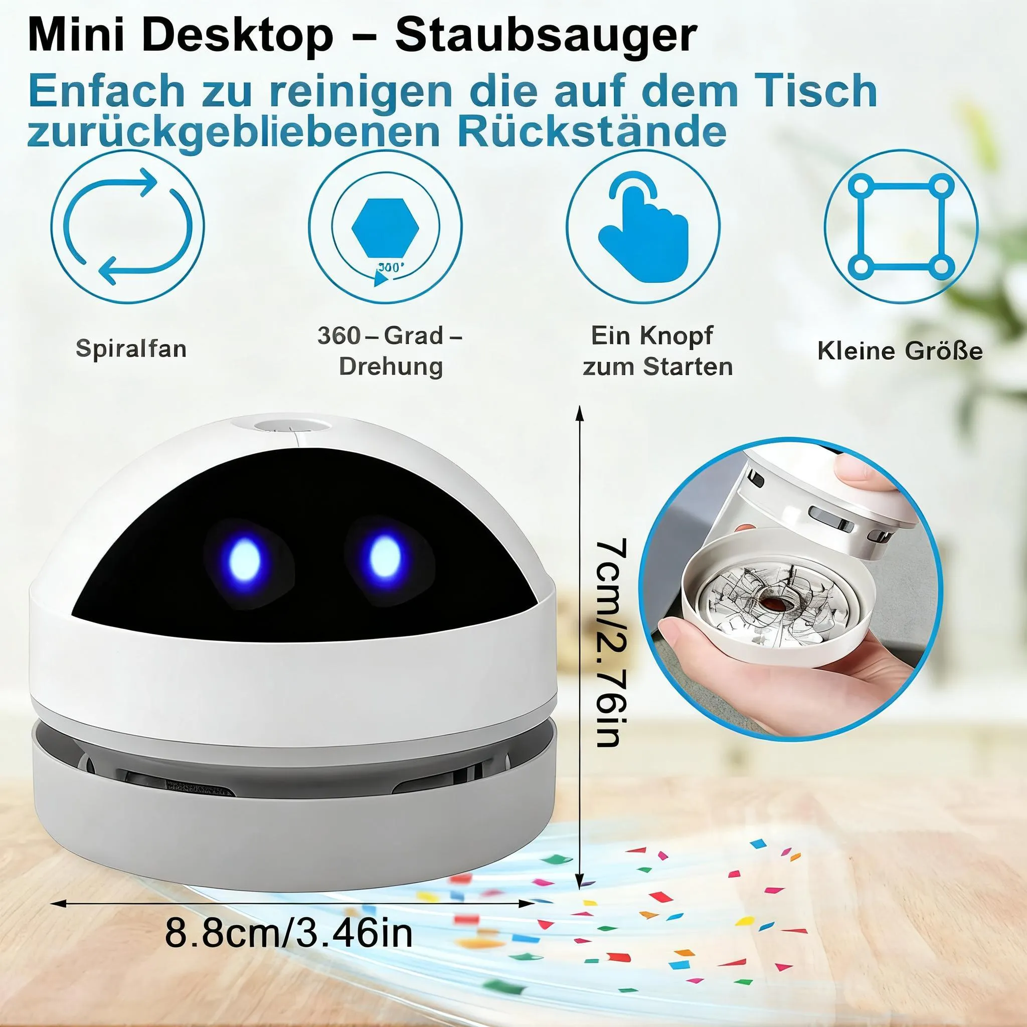 Ein kleiner weißer Desktop-Staubsauger mit blauen LED-Augen saugt Konfetti auf.