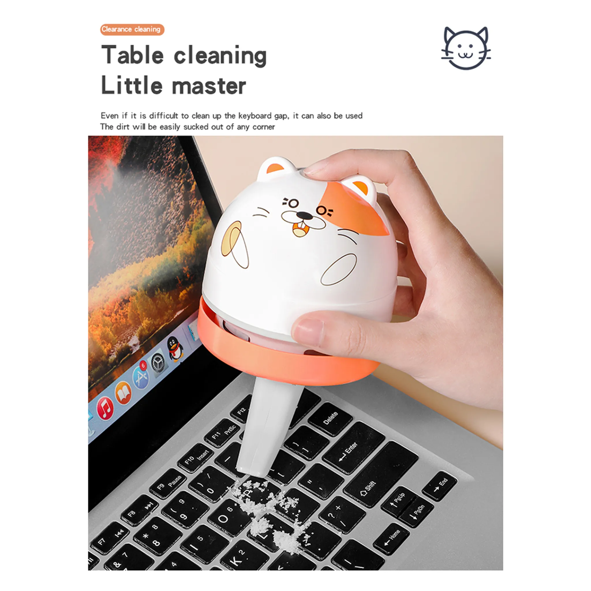 Eine Katze-förmige Tastaturreiniger saugt Schmutz von einer Tastatur auf.