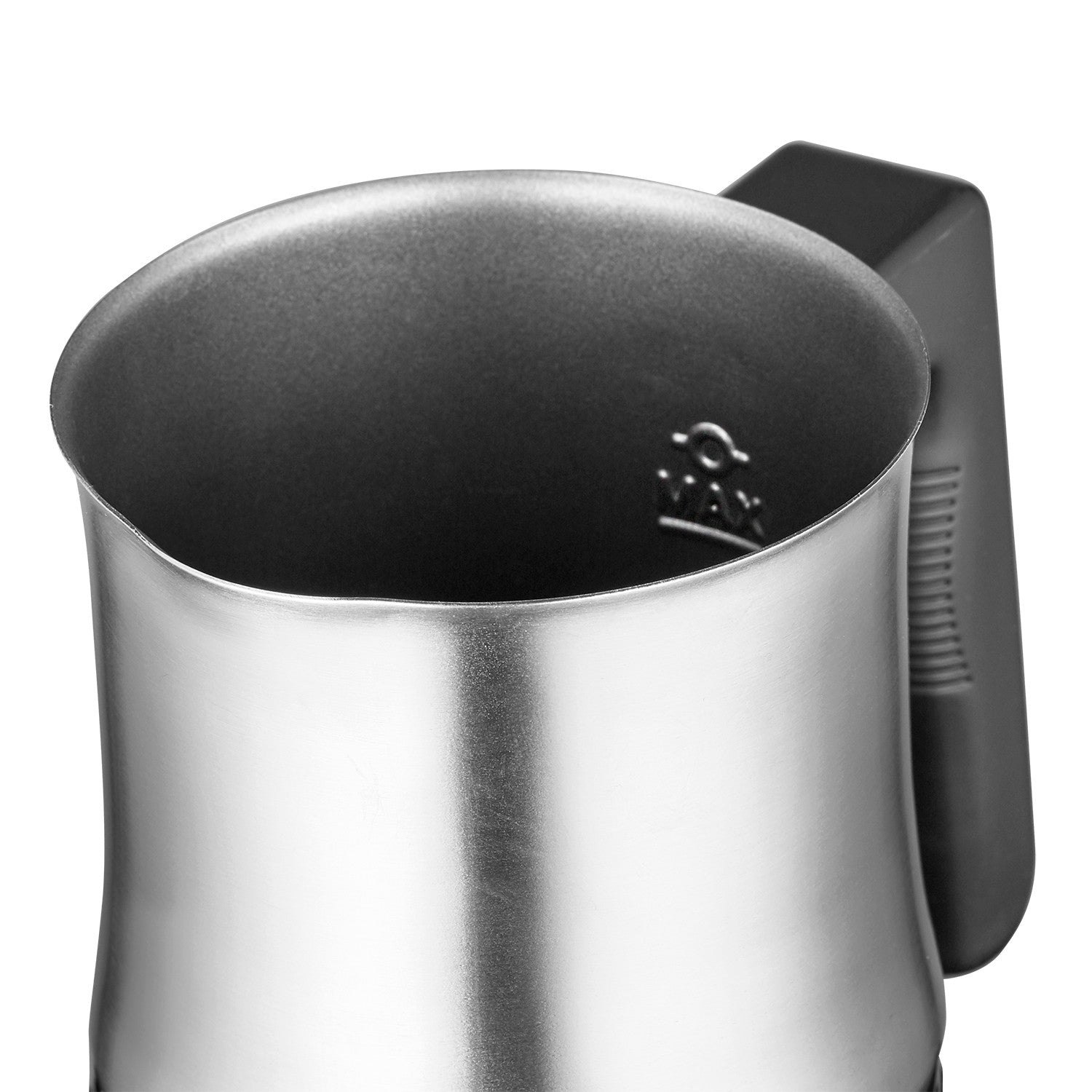 A silver milk frothing pitcher with a black handle, close-up view.