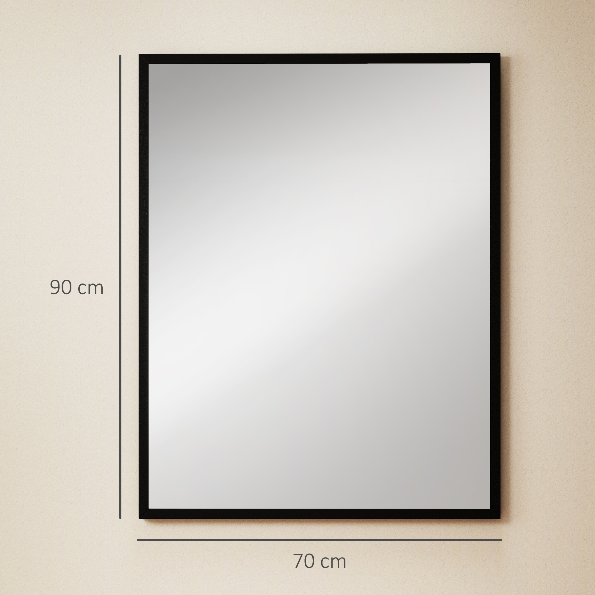 Un espejo rectangular negro cuelga de una pared color crema. Dimensiones: 90 cm alto, 70 cm ancho.