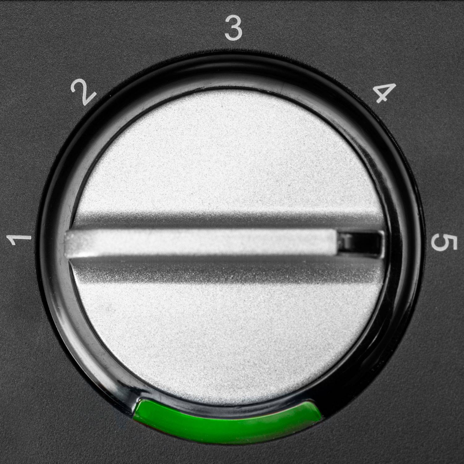 A silver dial with markings from 1 to 5 on a black background.