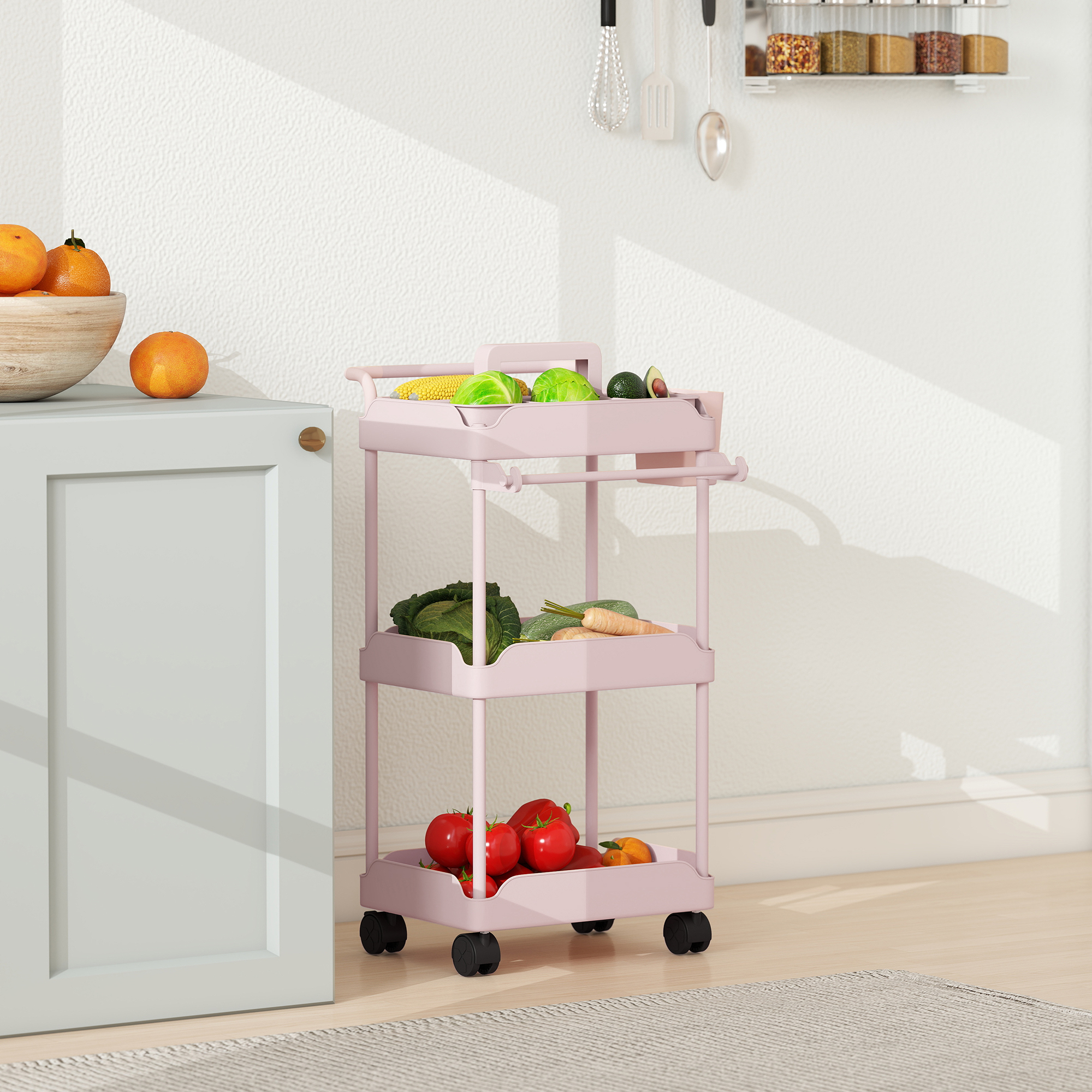 Un carrito rosado con verduras y frutas junto a un armario azul claro.