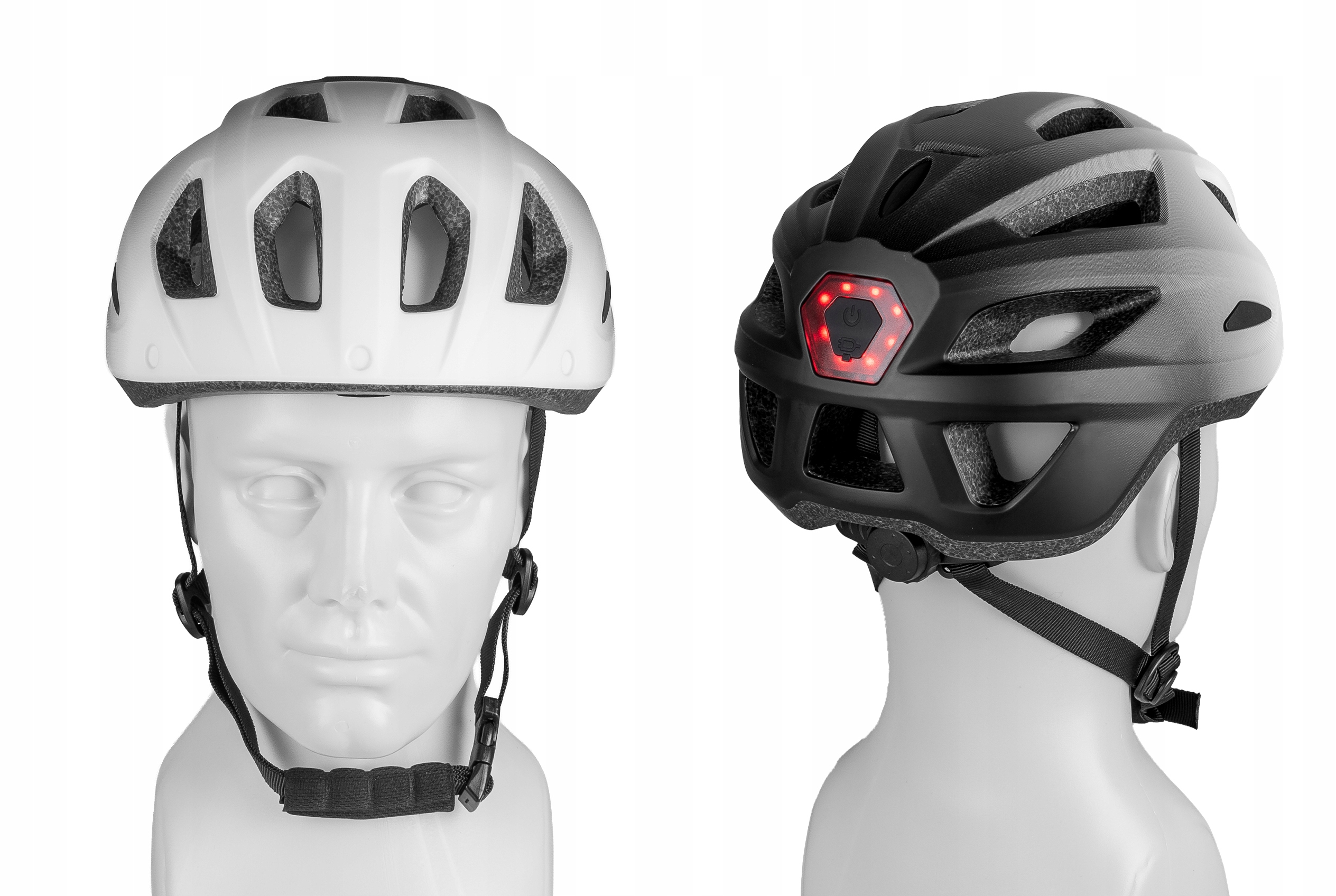 Dwa kaski rowerowe: biały i czarny ze światłem tylnym. Na białych manekinach.