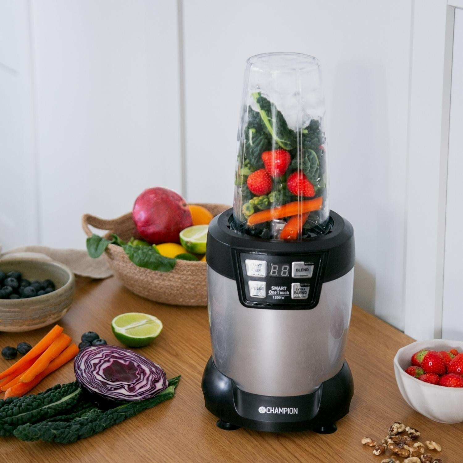 A blender filled with fruits and vegetables, ready to make a smoothie.