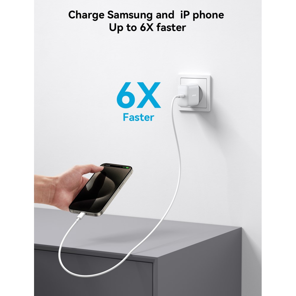Un telefono è collegato a un caricabatterie collegato a una presa a muro. 6X più veloce.