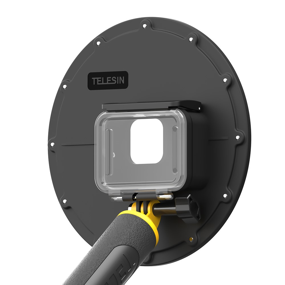 Zwarte Telesin adapter met transparante behuizing en gele grip, witte achtergrond.