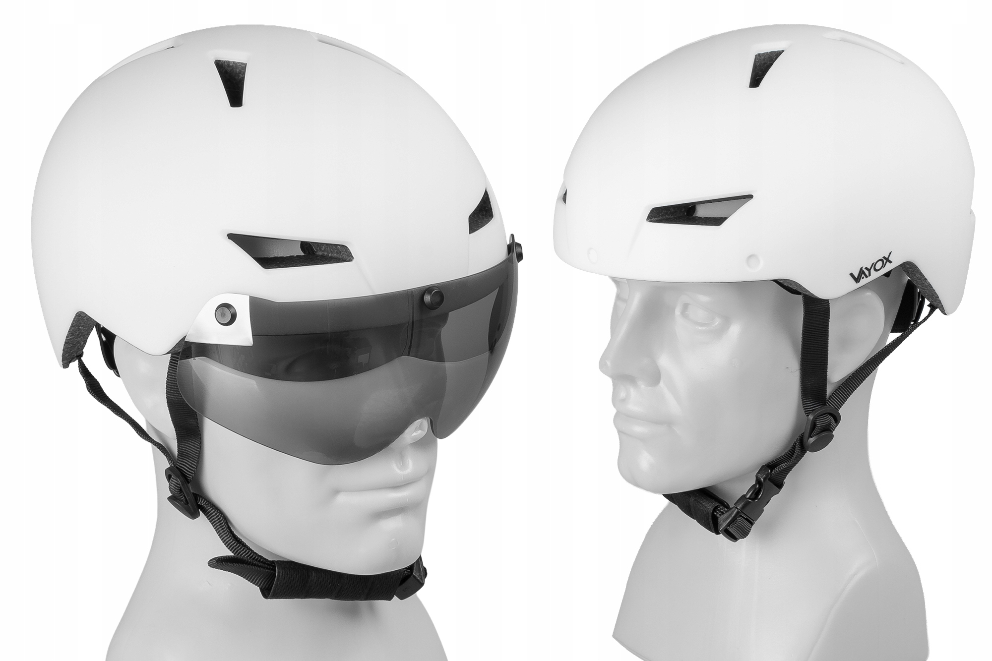 Dwa białe kaski rowerowe z wizjerami na manekinach. Jeden z wizjerem z przodu.