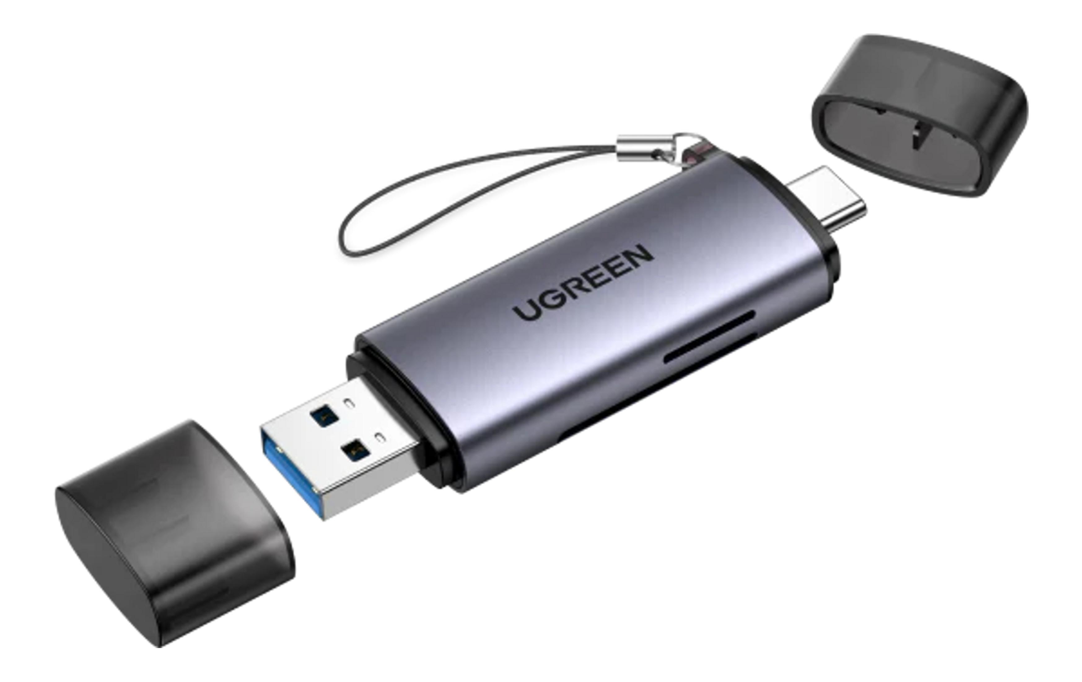 Szary adapter USB-C z zdejmowanymi nakładkami, wtyczką USB-A i smyczą.