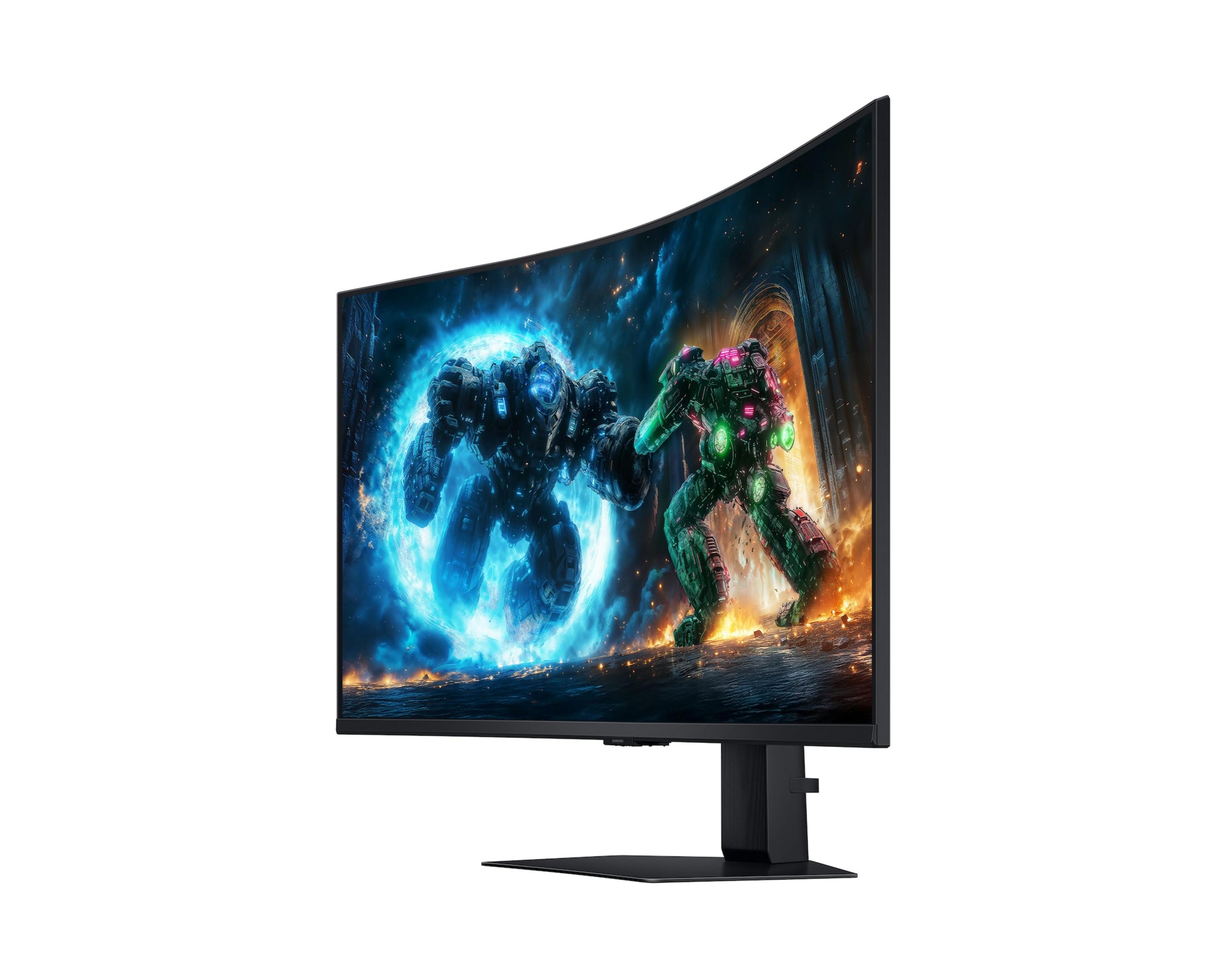A curved monitor displays two mech warriors, one blue and one green, in a digital battle.