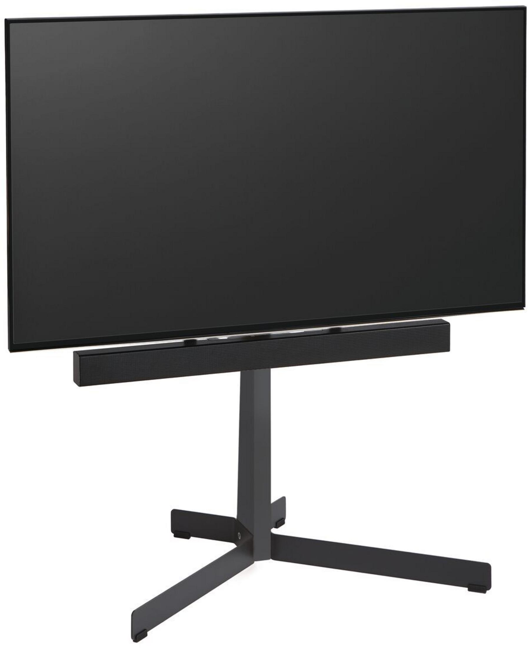 Czarny telewizor stoi na stylowym ciemnym stojaku z soundbarem pod spodem.