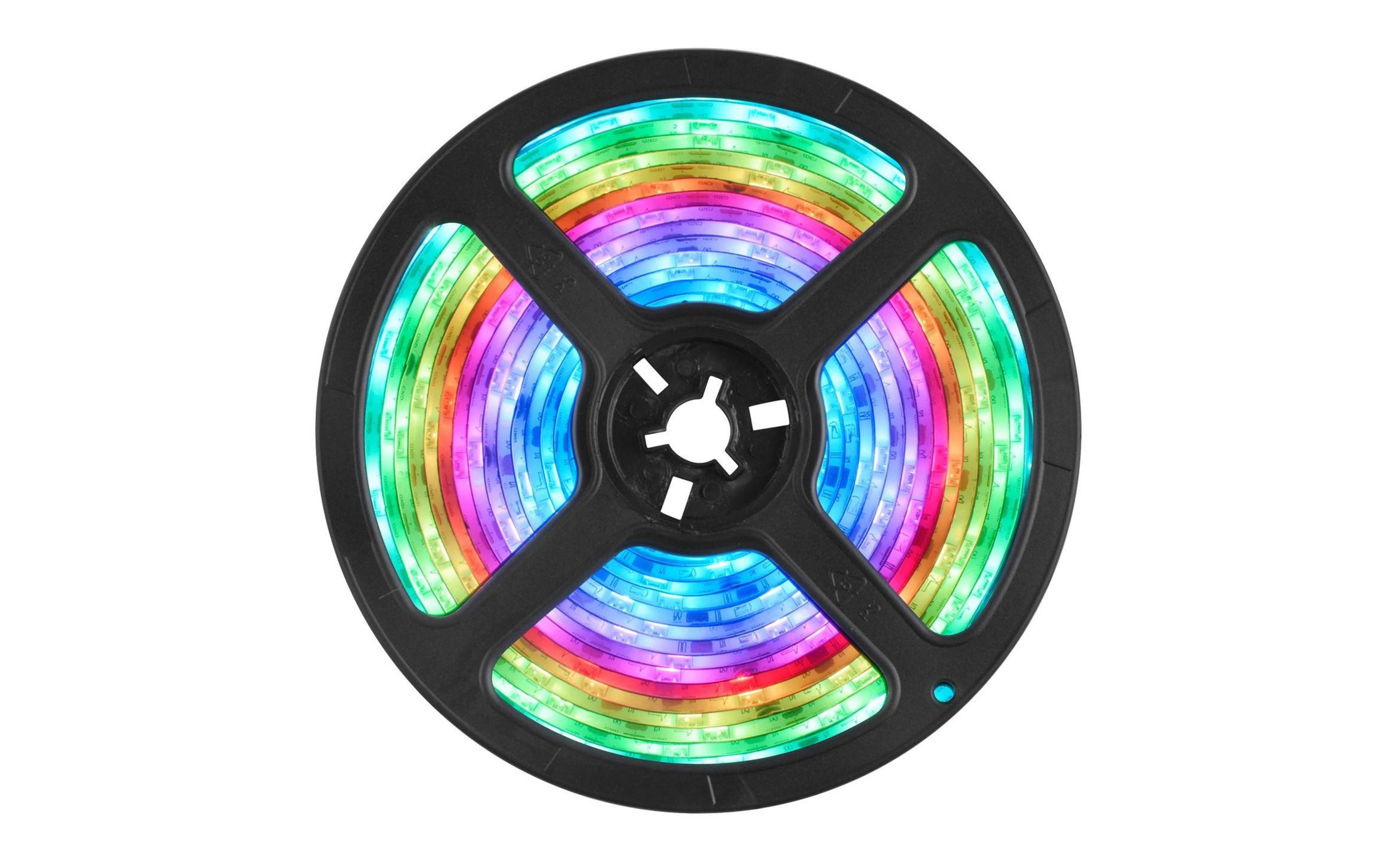 Un rocchetto di strisce LED colorate, avvolto. Brillano nei colori dell'arcobaleno.
