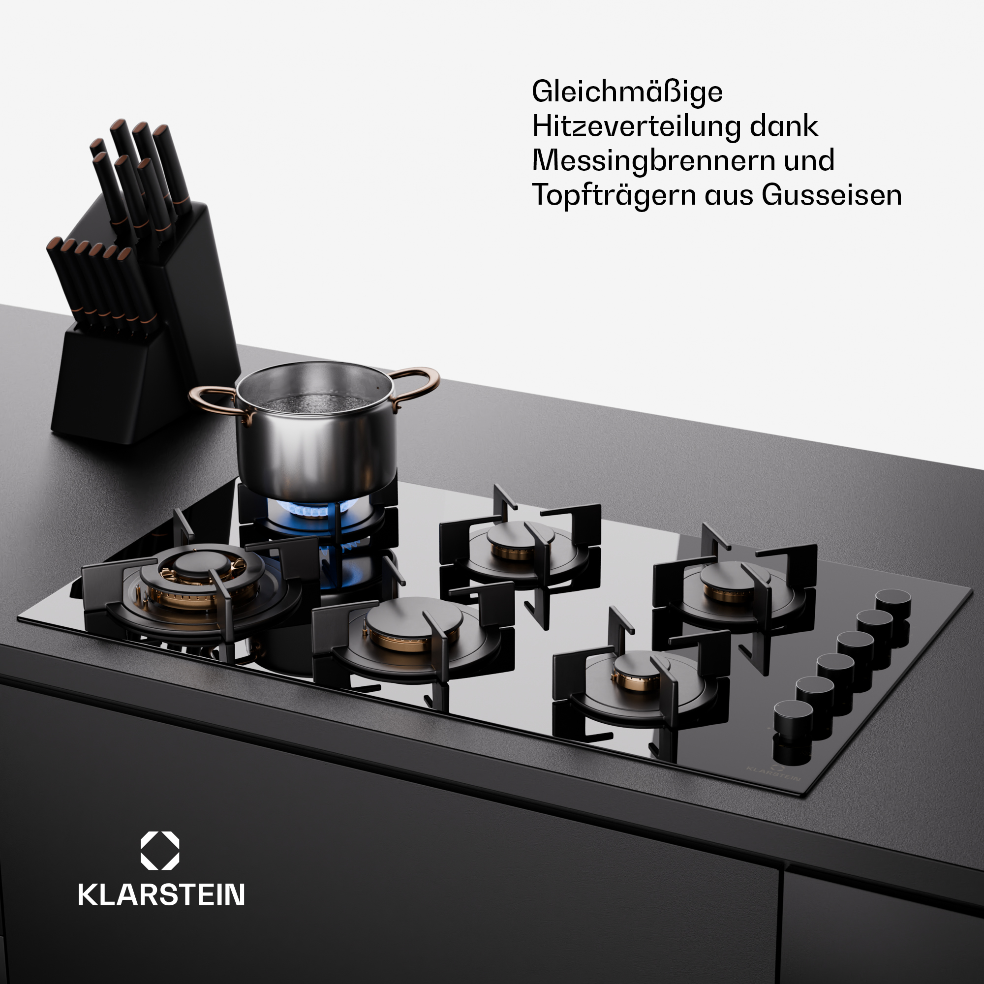 Gaskochfeld mit fünf Brennern, Topf und Messerkolben.