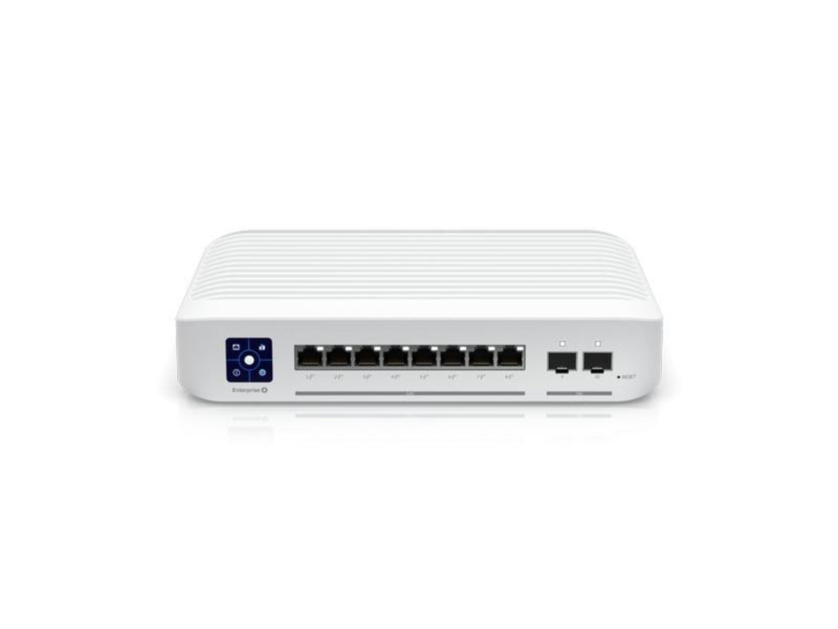 Uno switch di rete bianco con schermo e più porte.