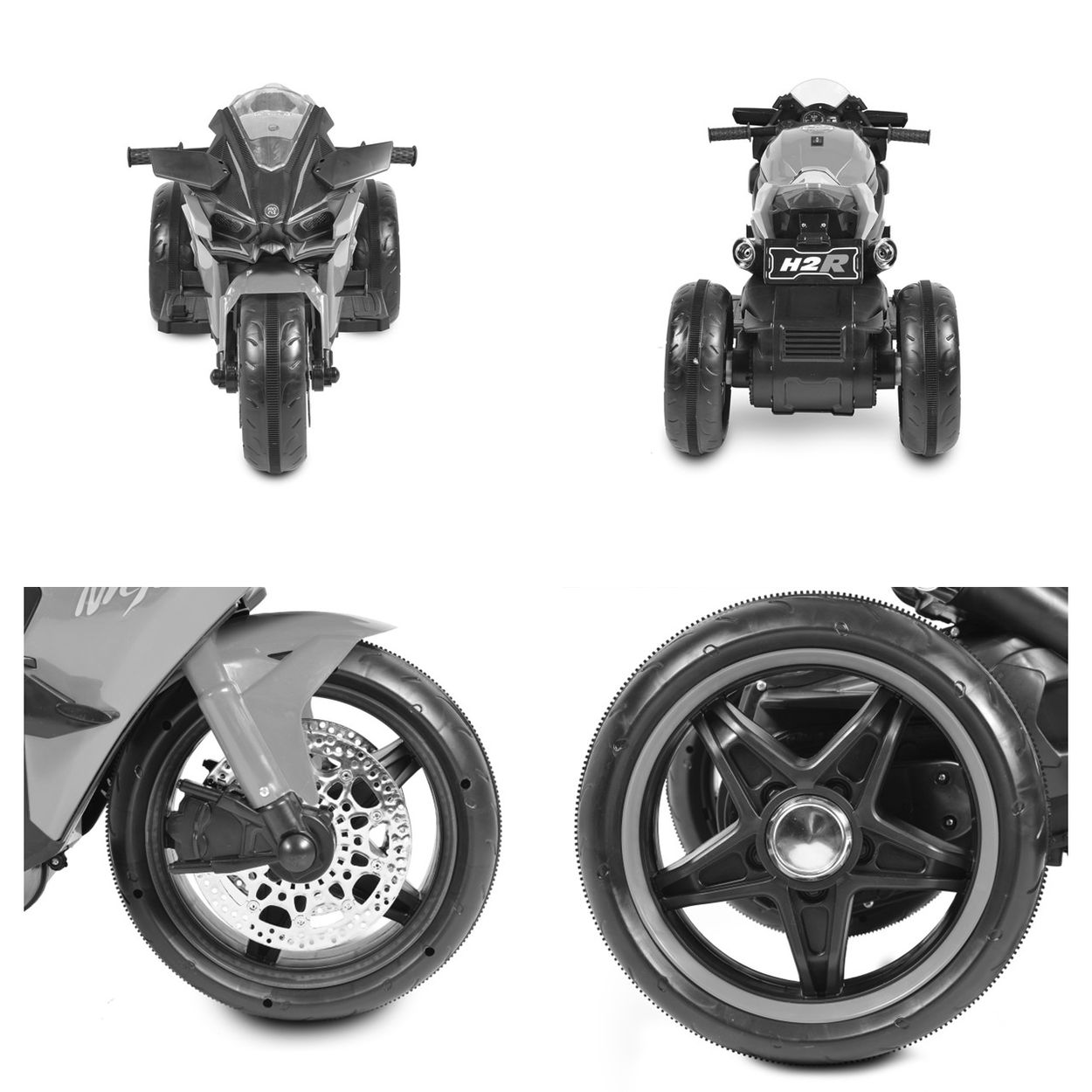 Ein graues Spielzeugmotorrad mit drei Rädern und Scheinwerfern.