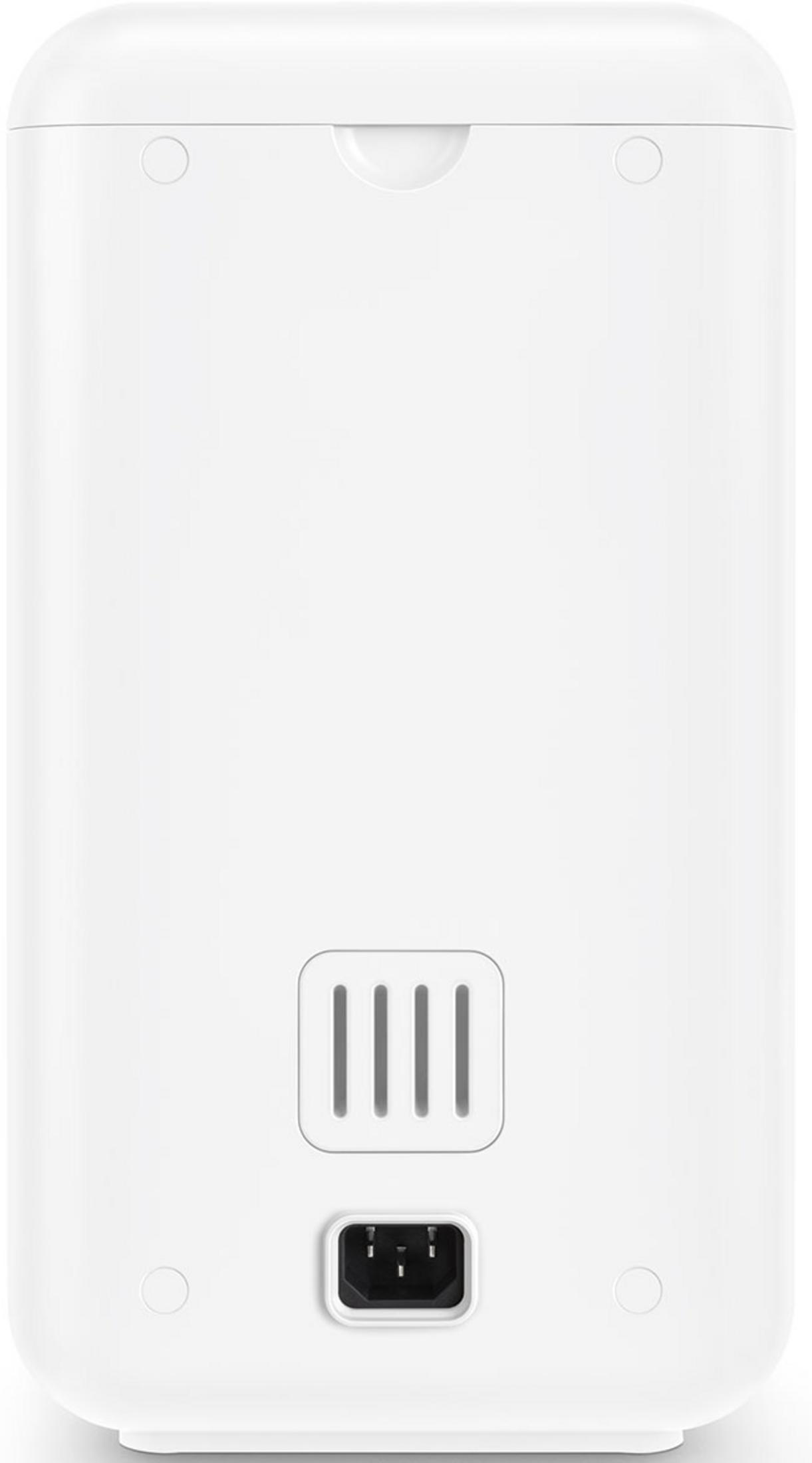 Biały tył urządzenia z otworami wentylacyjnymi i złączem zasilania.