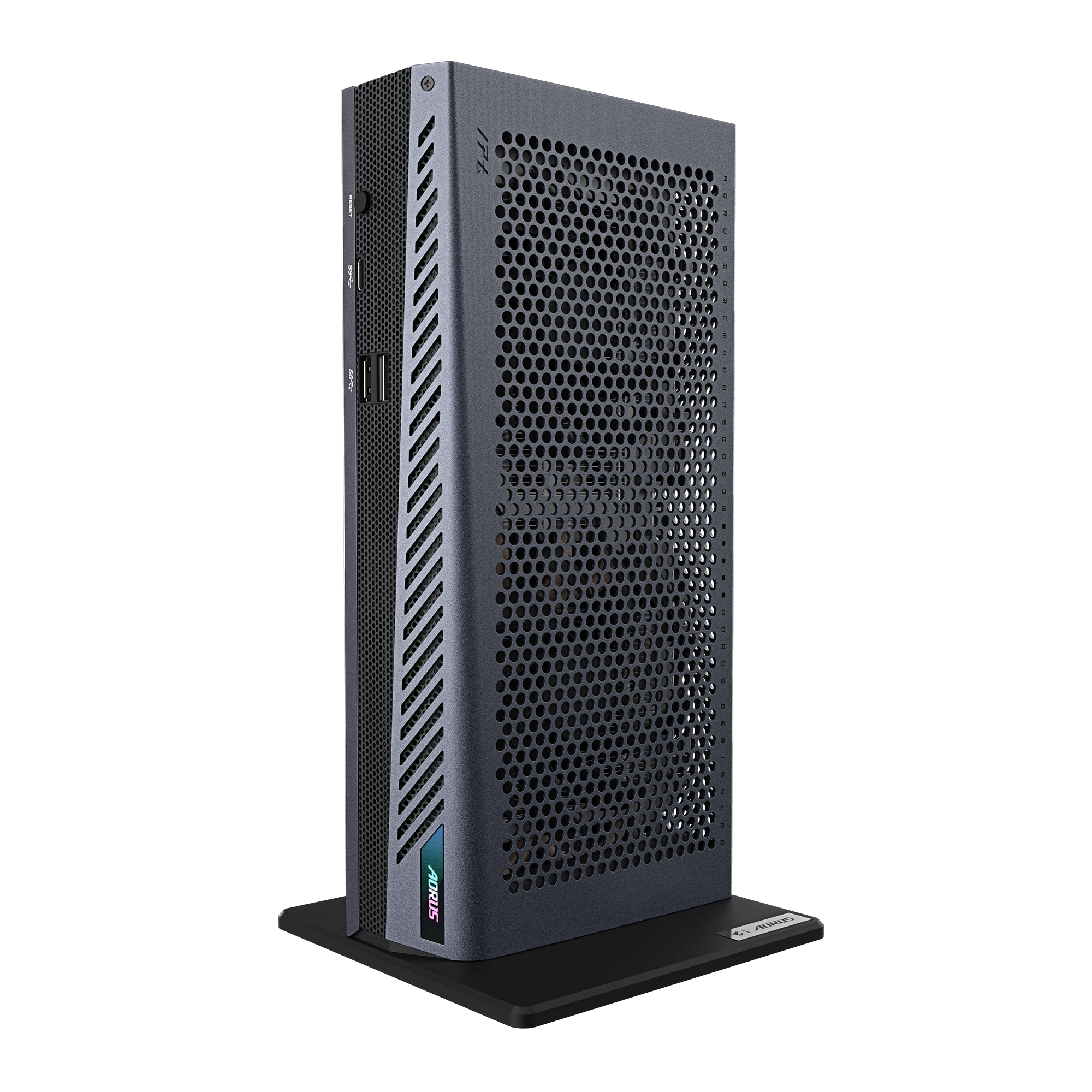 Un PC grigio compatto su un supporto nero con prese d'aria e porte.