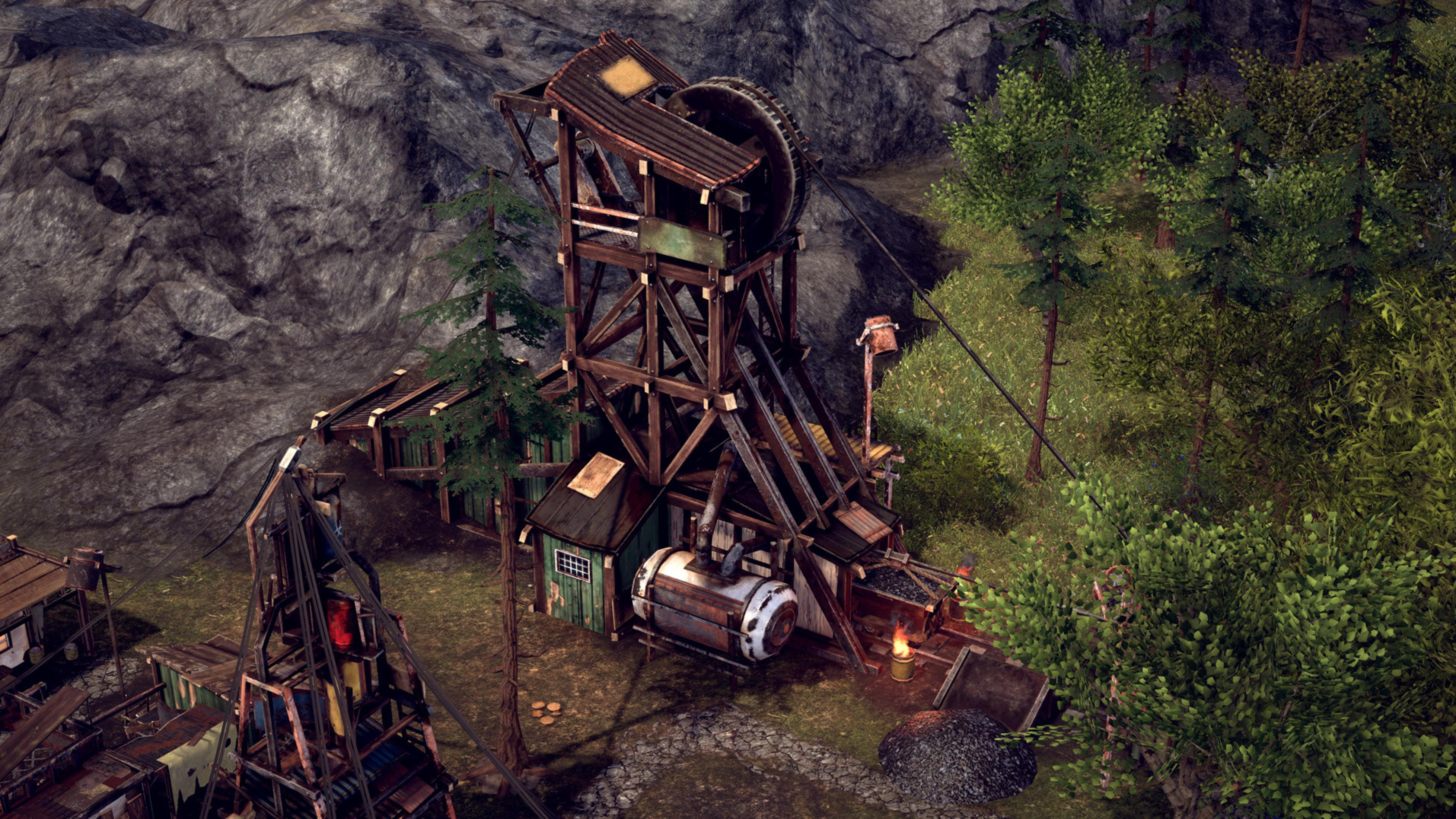 Holzbergwerk mit Förderrad und Bergen von Kohle neben Bäumen.