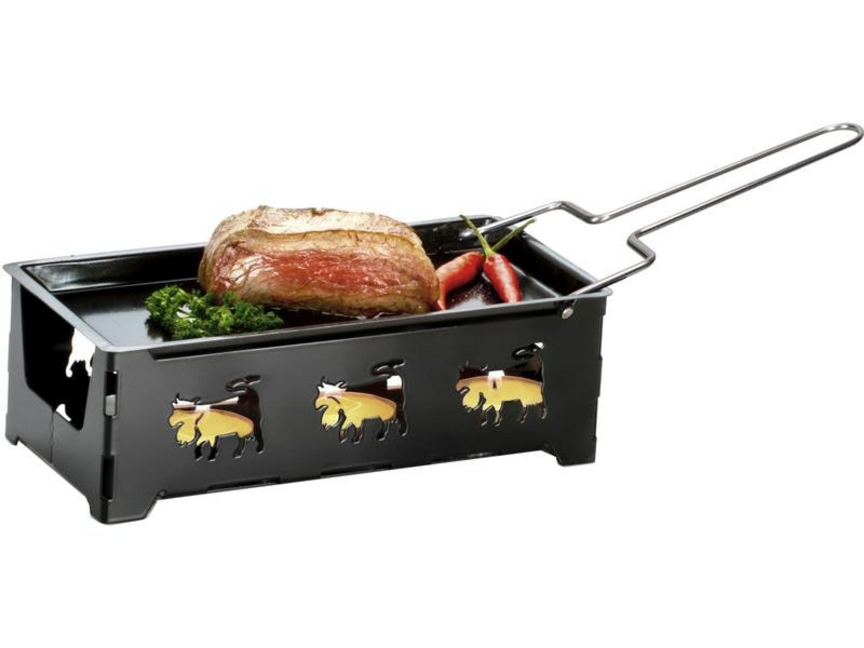 Ein gebratenes Steak mit Petersilie und Chilis in einem Grill mit Kuhmotiven.