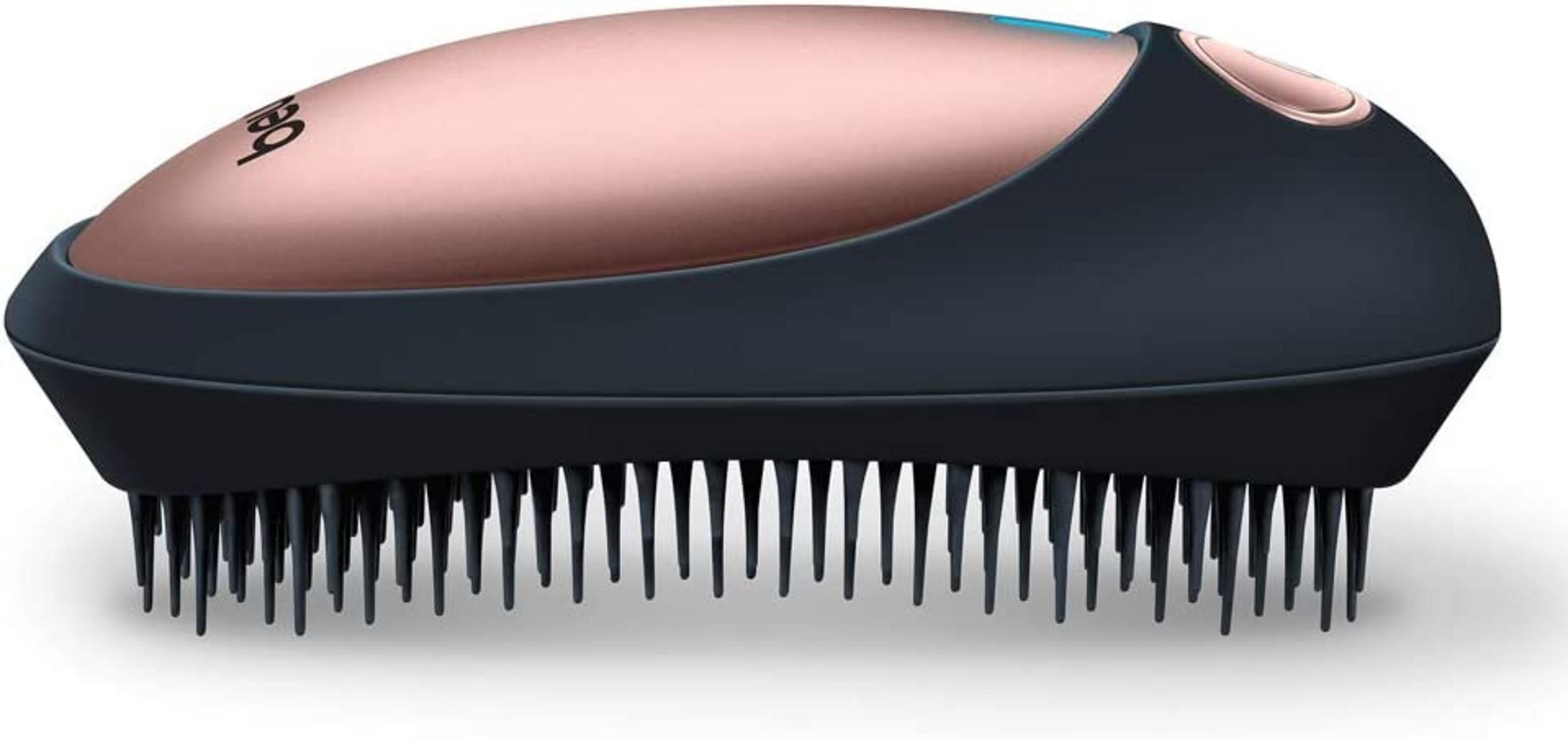Un dispositivo simile a una spazzola color oro rosa e antracite con molte setole.