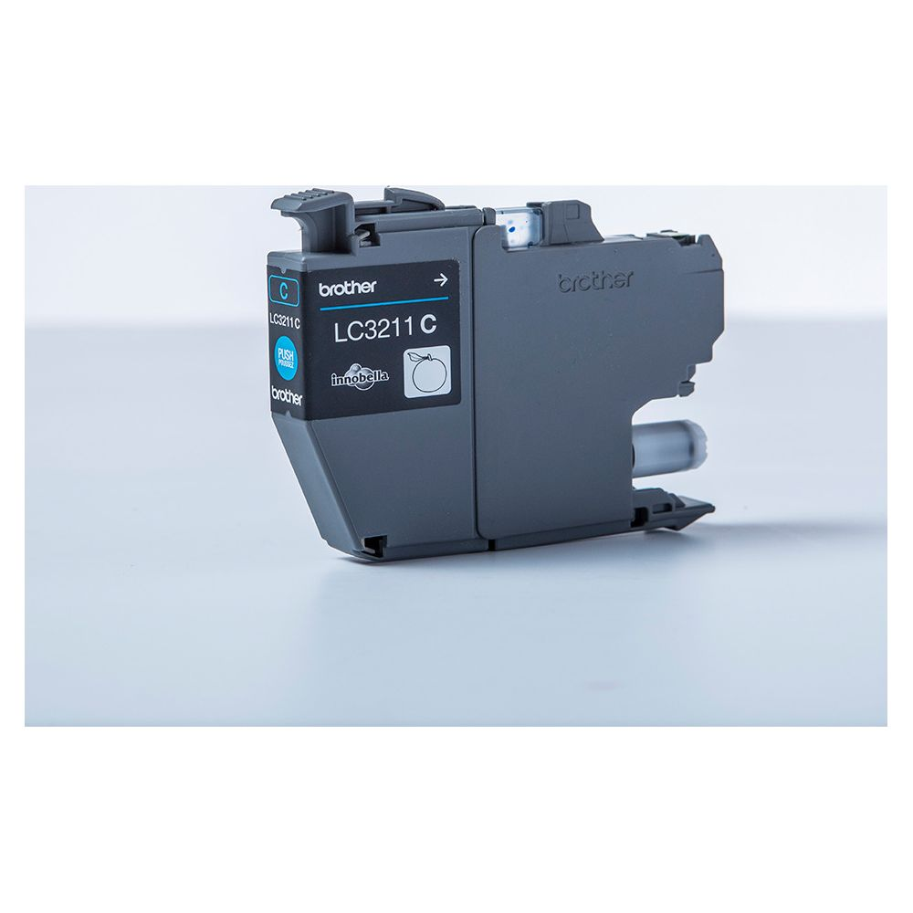 Szary tusz Brother LC3211 C z niebieskim przyciskiem.